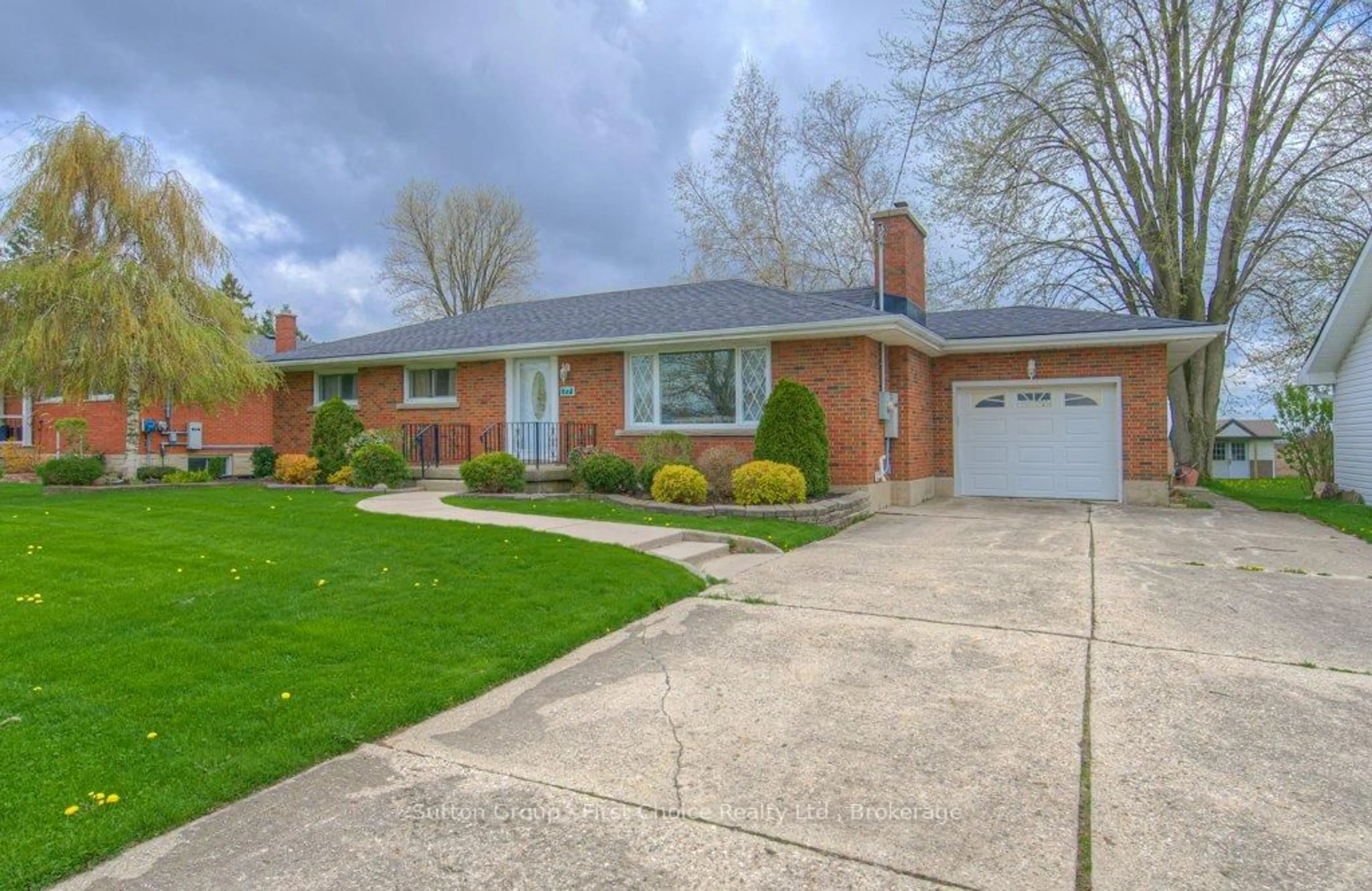 Home with brick exterior material, street for 77 Huron Rd, Perth South Ontario N0K 1X0