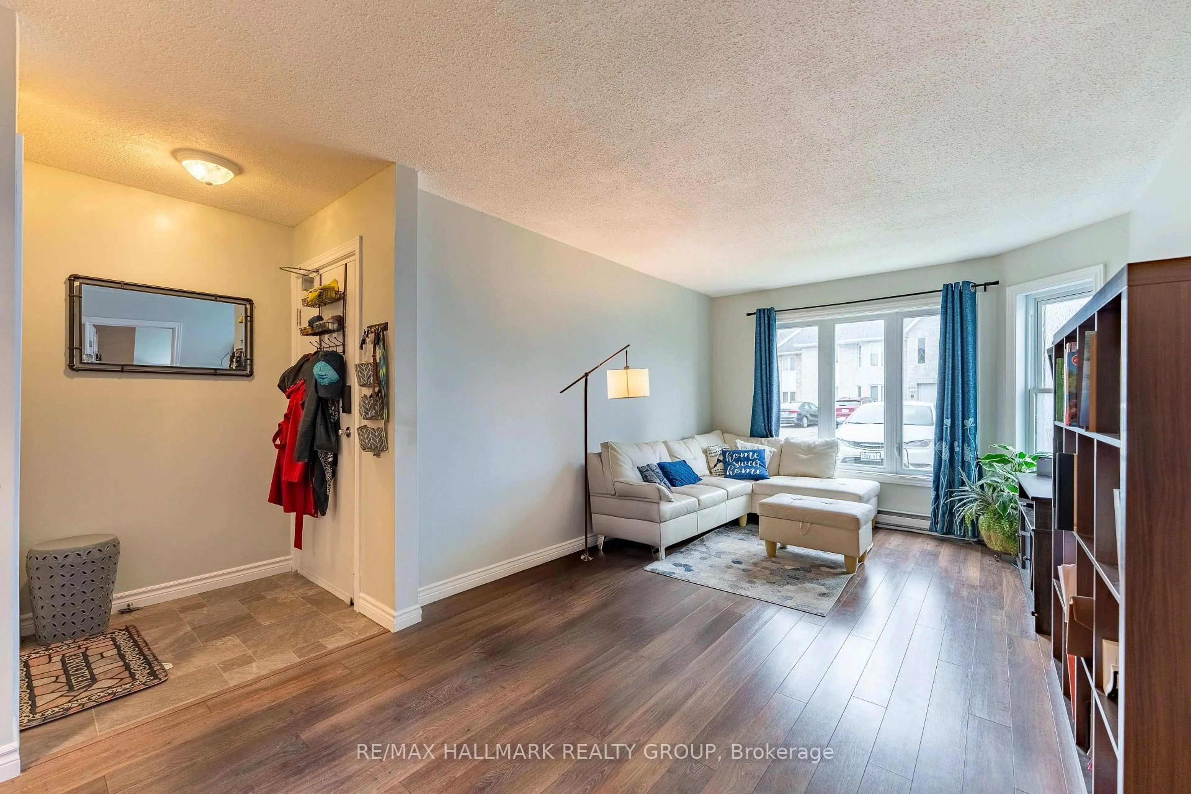 Living room with furniture, wood/laminate floor for 185 Du Comte Rte #104A, Alfred and Plantagenet Ontario K0B 1L0