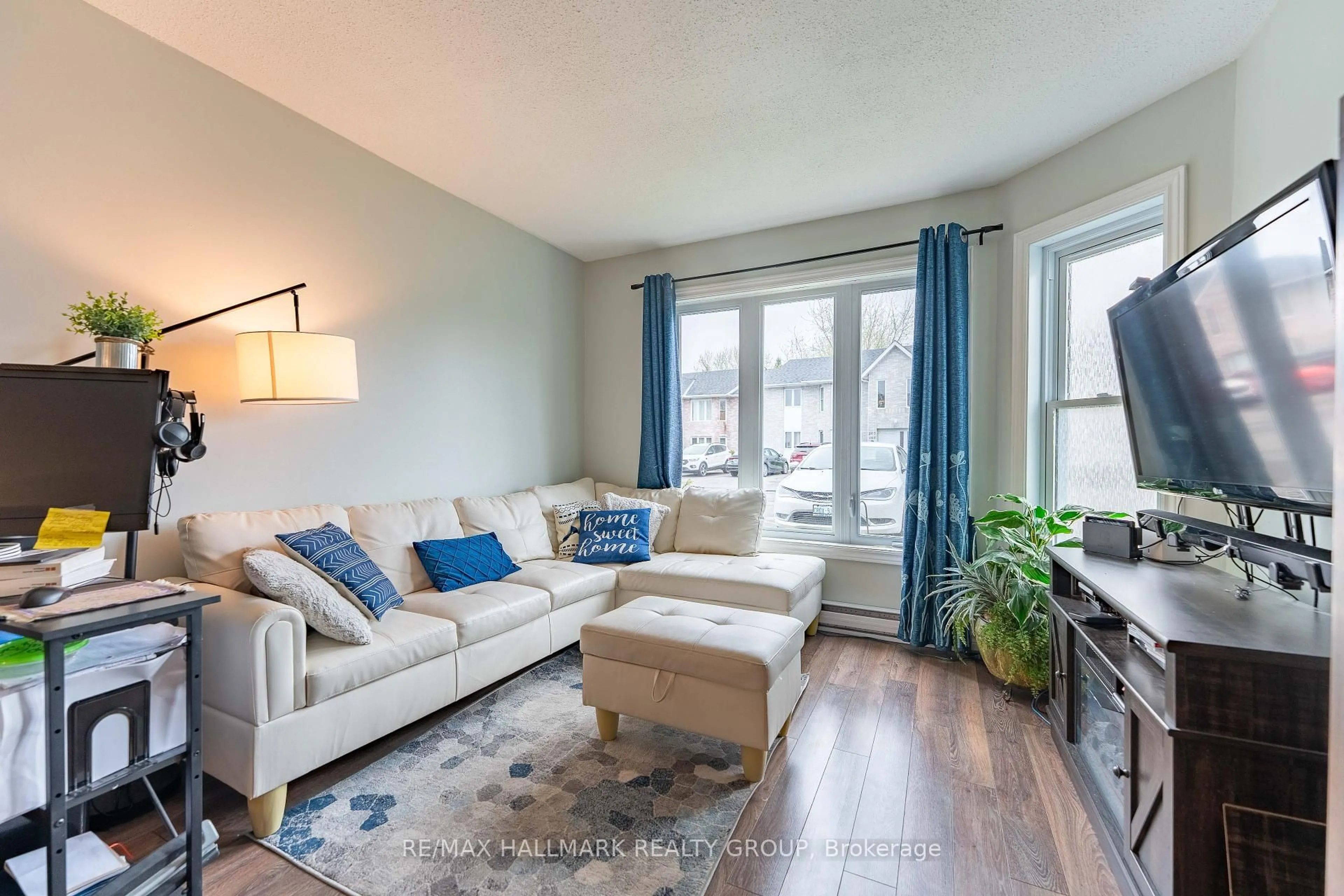 Living room with furniture, wood/laminate floor for 185 Du Comte Rte #104A, Alfred and Plantagenet Ontario K0B 1L0