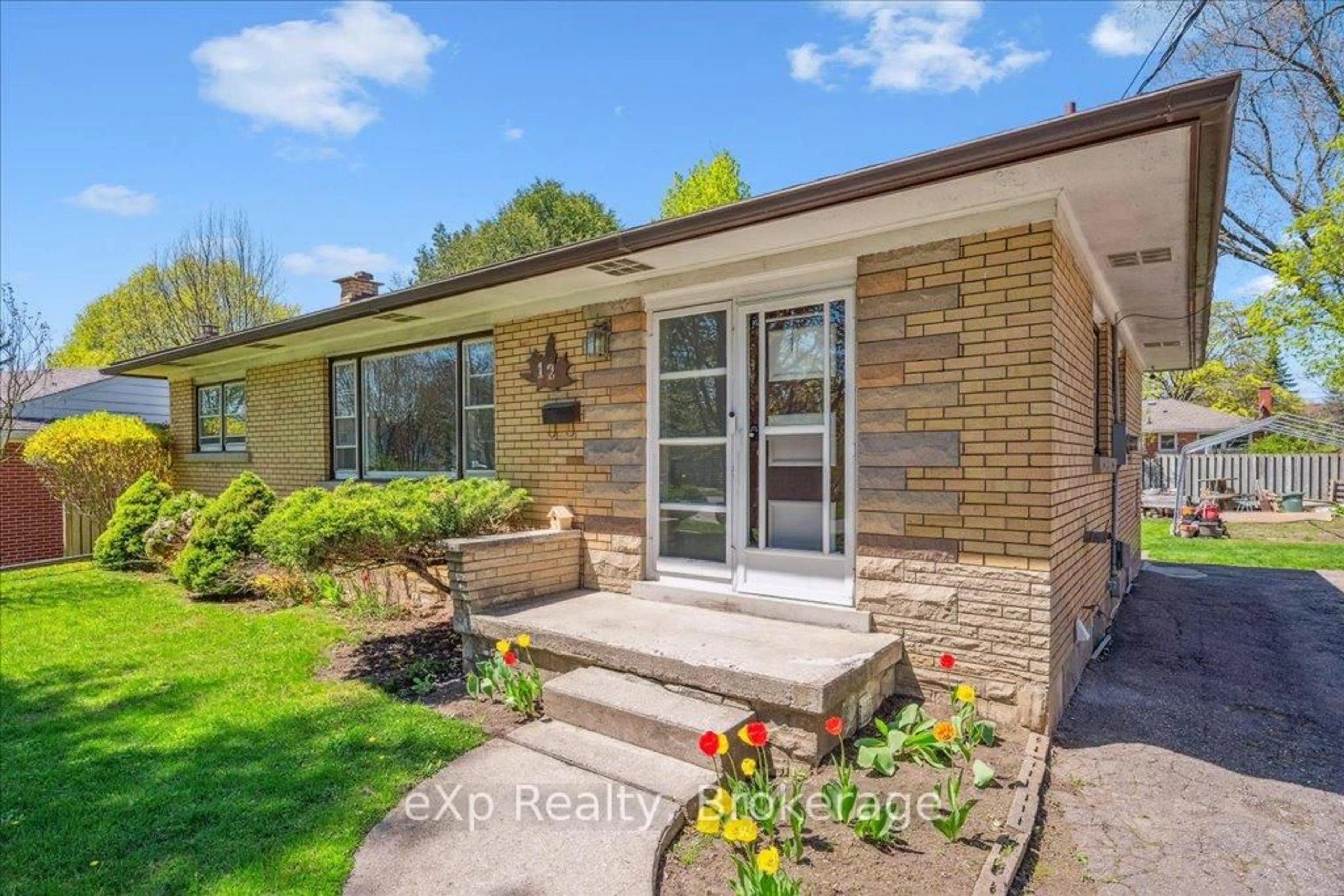 Home with brick exterior material, street for 12 Lincoln Cres, Guelph Ontario N1E 1Y8