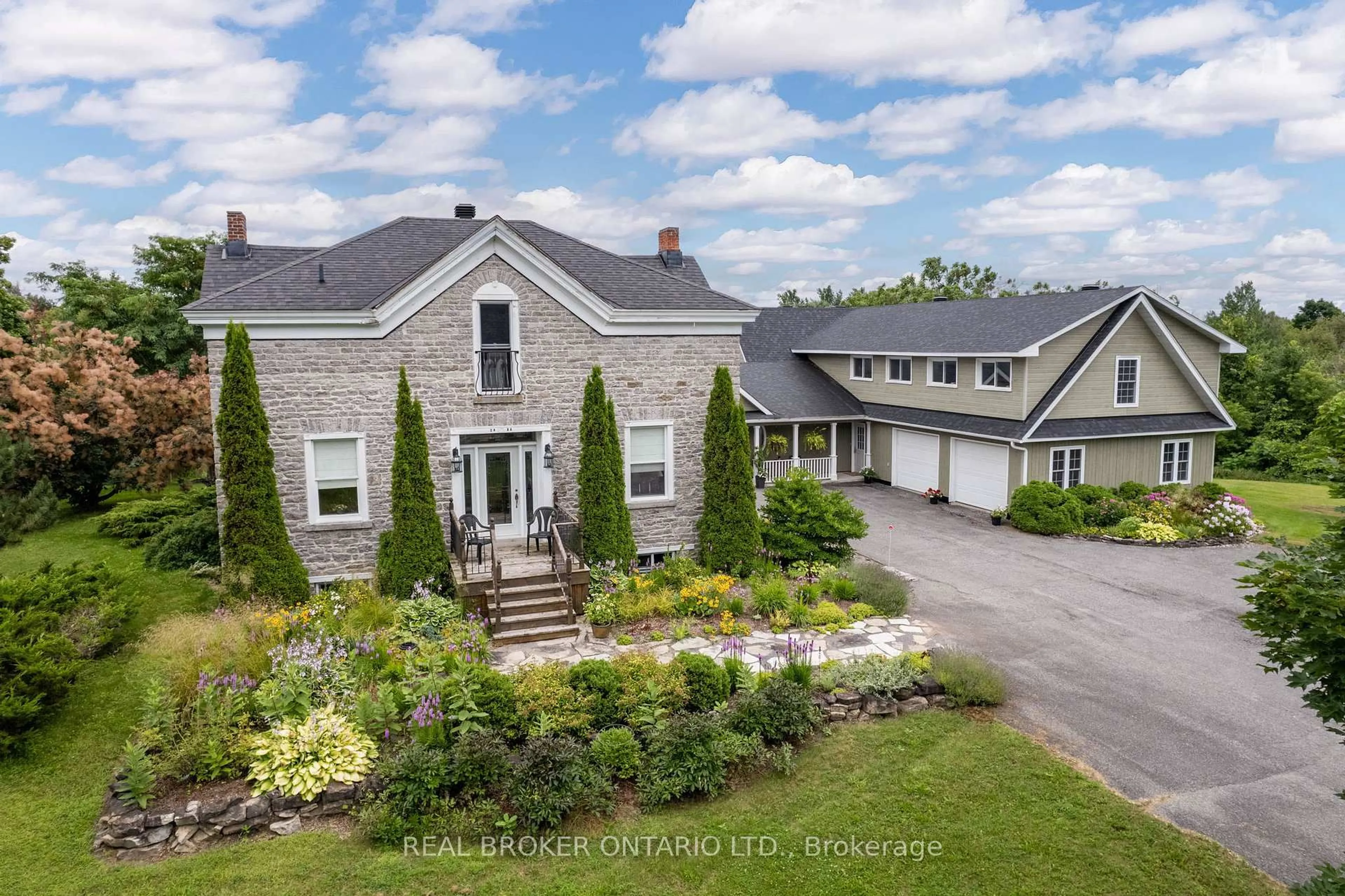 A pic from outside/outdoor area/front of a property/back of a property/a pic from drone, street for 2486 County Rd 18 Rd, North Grenville Ontario K0G 1J0