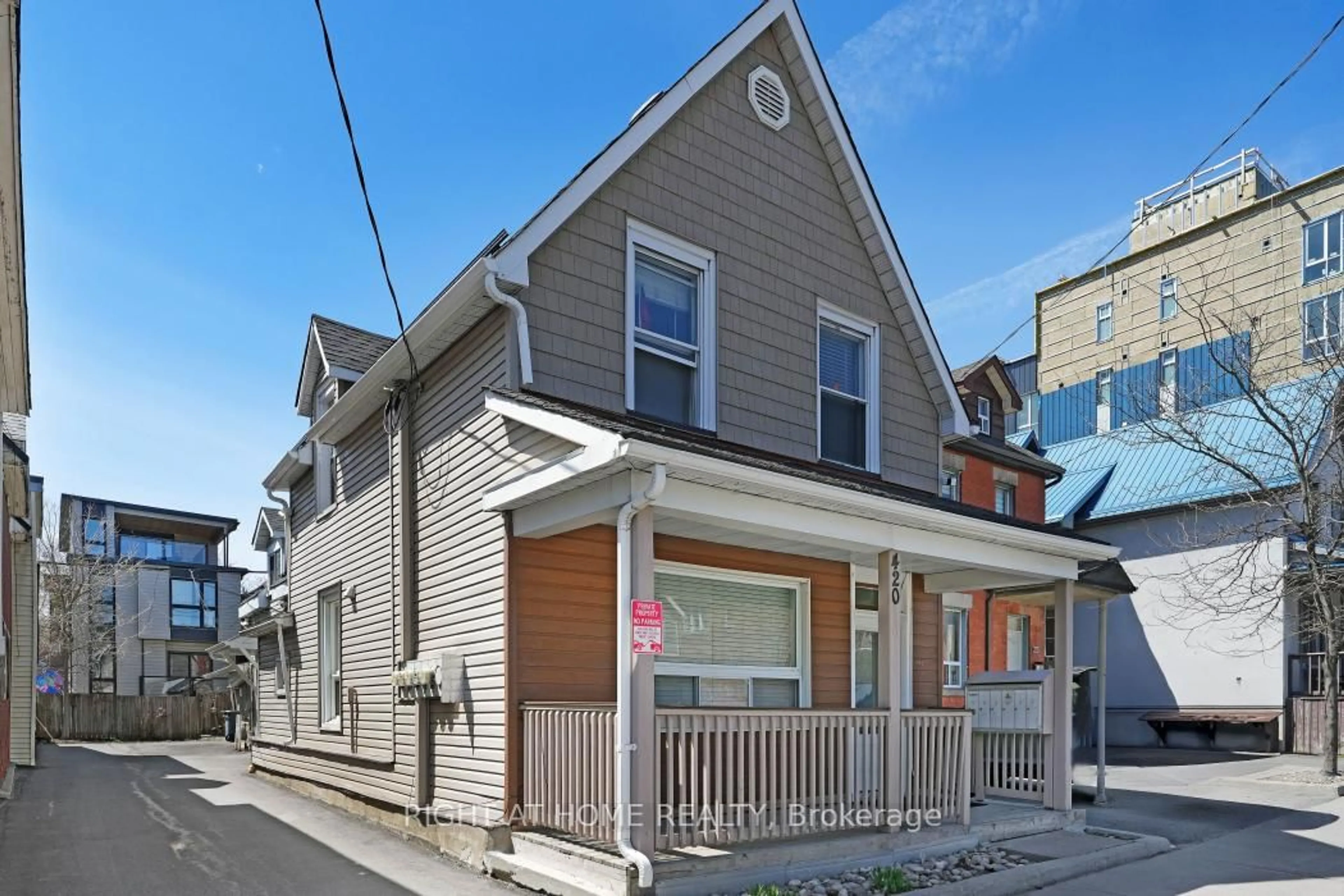 Home with vinyl exterior material, street for 420 Bronson Ave, Ottawa Ontario K1R 6J6