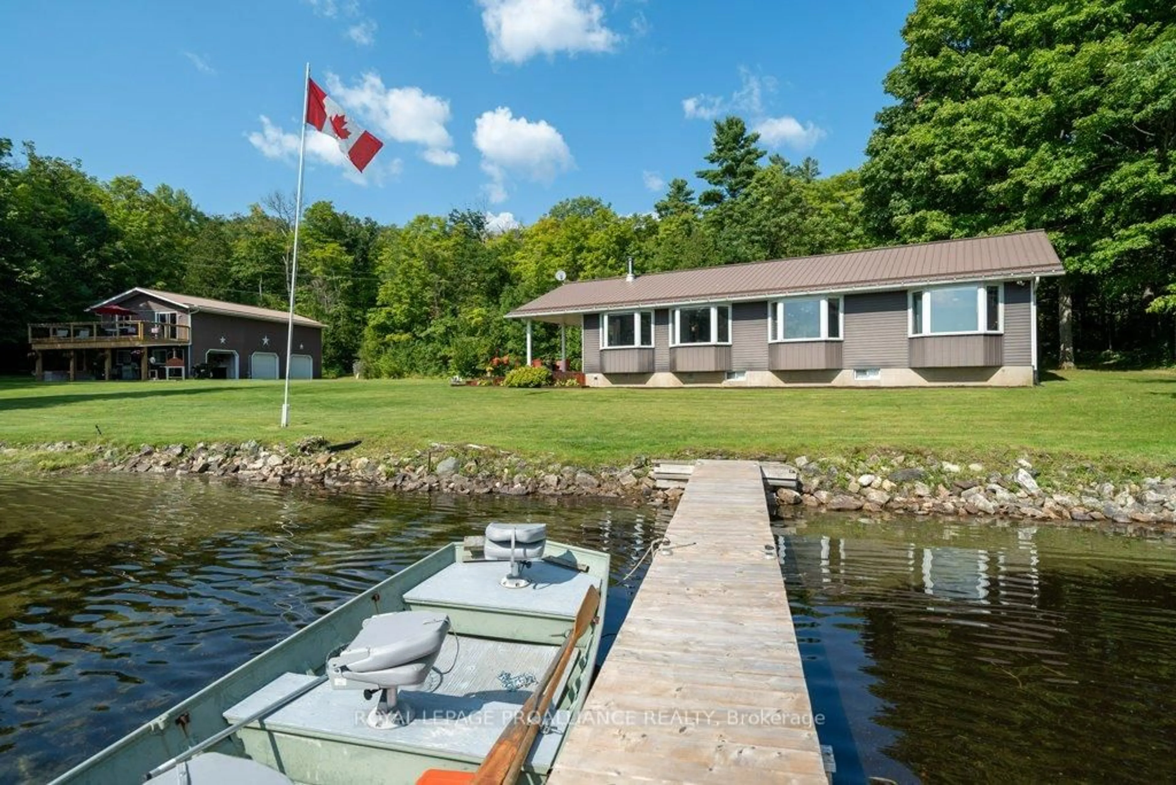 A pic from outside/outdoor area/front of a property/back of a property/a pic from drone, water/lake/river/ocean view for 1049 Perry Lane, Cloyne Ontario K0H 1K0