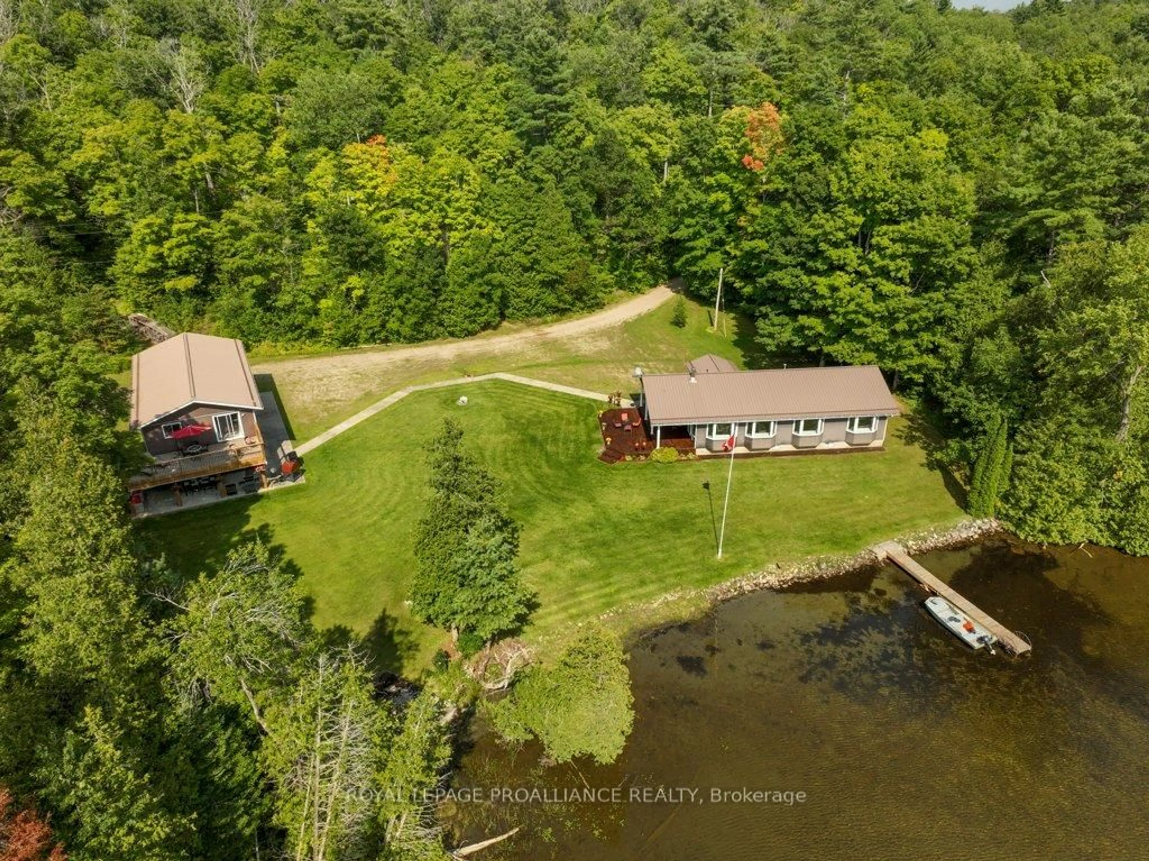 A pic from outside/outdoor area/front of a property/back of a property/a pic from drone, water/lake/river/ocean view for 1049 Perry Lane, Cloyne Ontario K0H 1K0