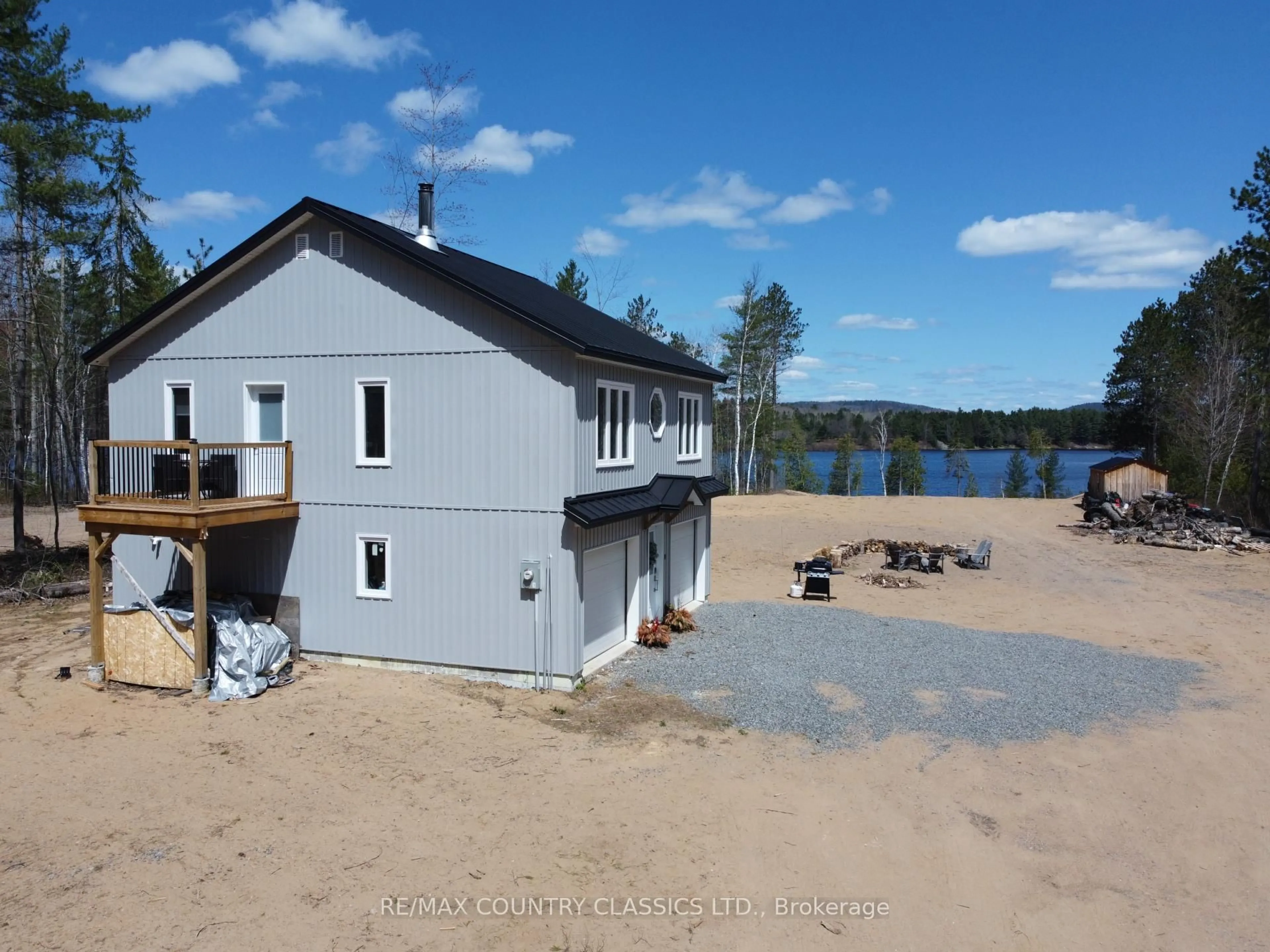 A pic from outside/outdoor area/front of a property/back of a property/a pic from drone, water/lake/river/ocean view for 237 Grunwald Rd, Barry's Bay Ontario K0J 1B0