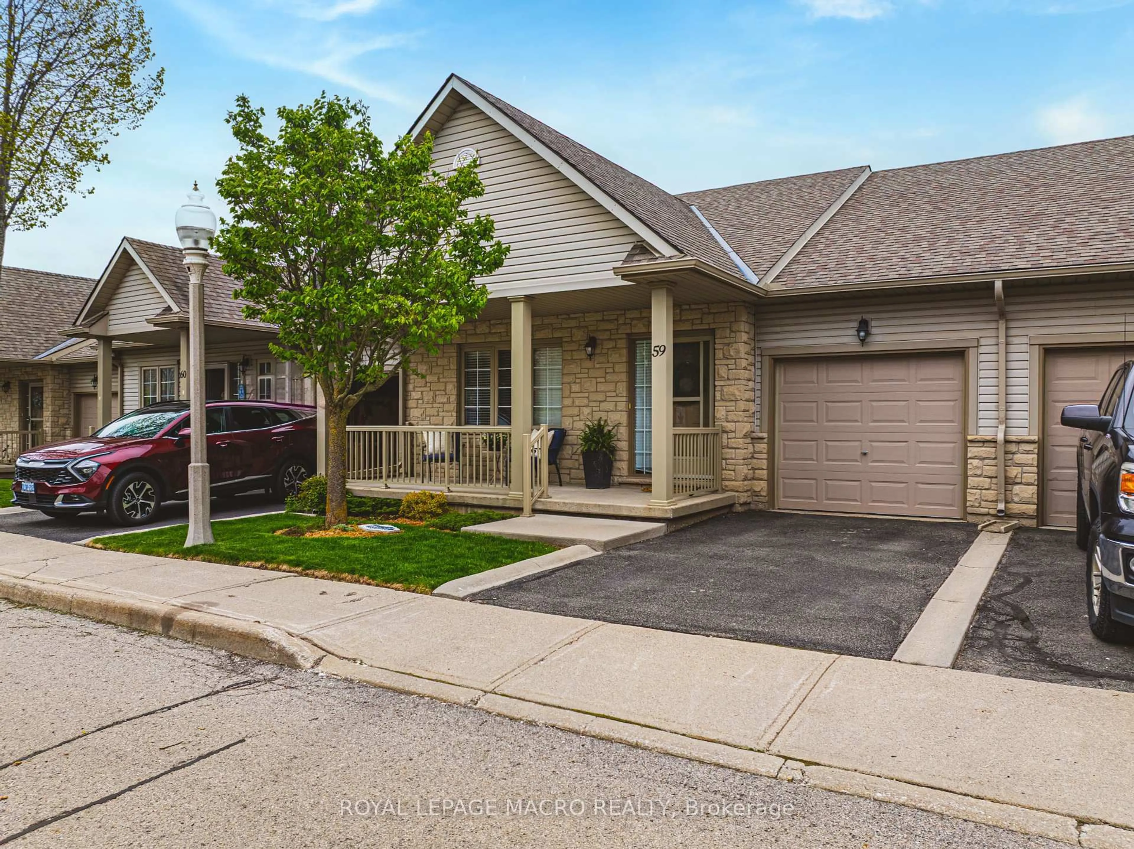 Home with brick exterior material, street for 34 Southbrook Dr #59, Hamilton Ontario L0R 1C0