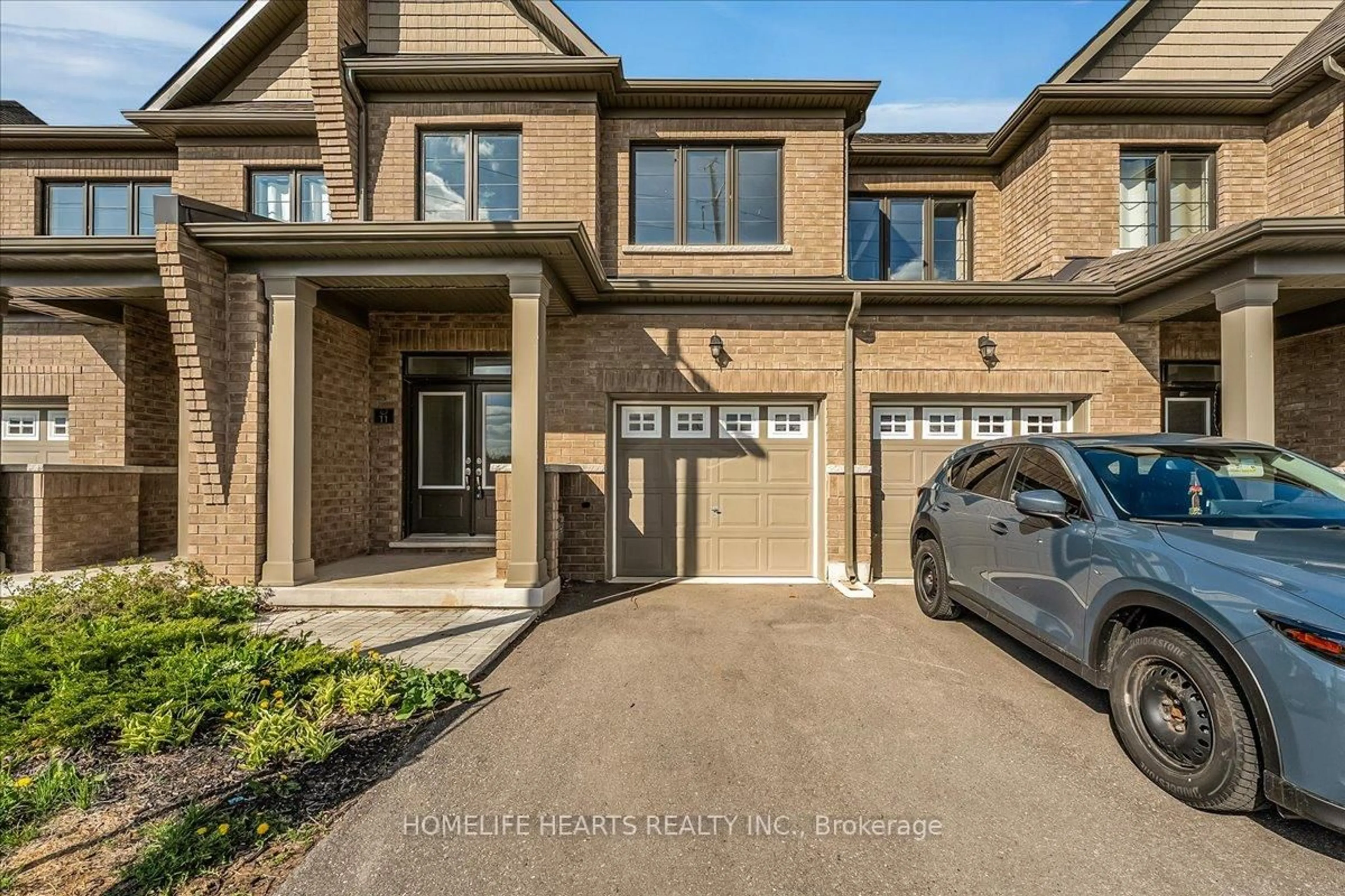 Home with brick exterior material, street for 166 Deerpath Dr ##11, Guelph Ontario N1K 1W6