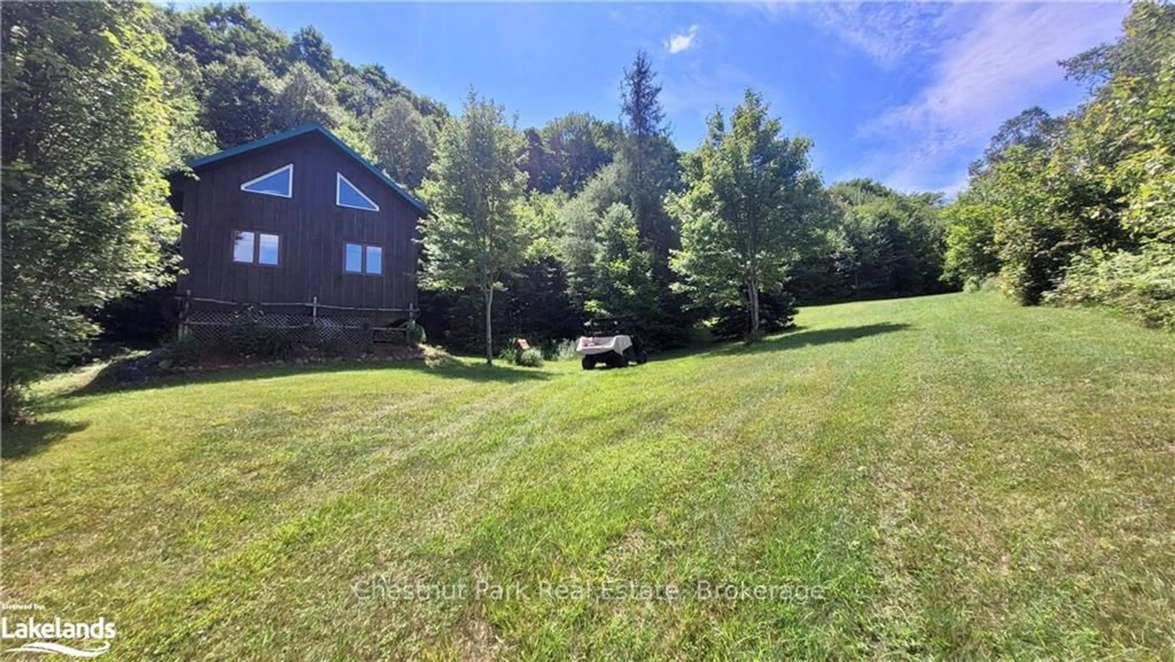 A pic from outside/outdoor area/front of a property/back of a property/a pic from drone, water/lake/river/ocean view for 1060 BAKER Sdrd, Bracebridge Ontario P1L 1W9
