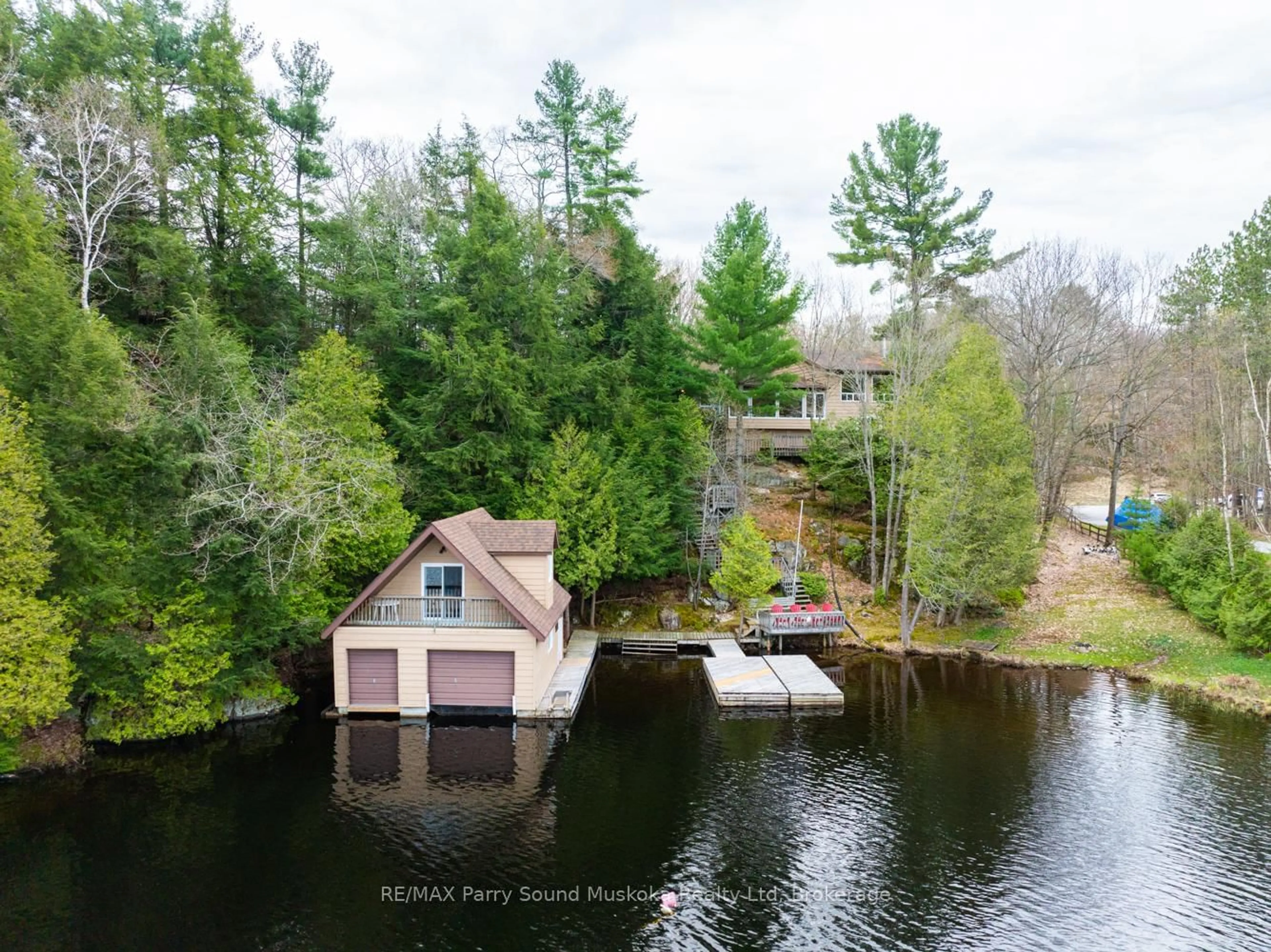 A pic from outside/outdoor area/front of a property/back of a property/a pic from drone, water/lake/river/ocean view for 17 Tapatoo Tr, Seguin Ontario P2A 2W8