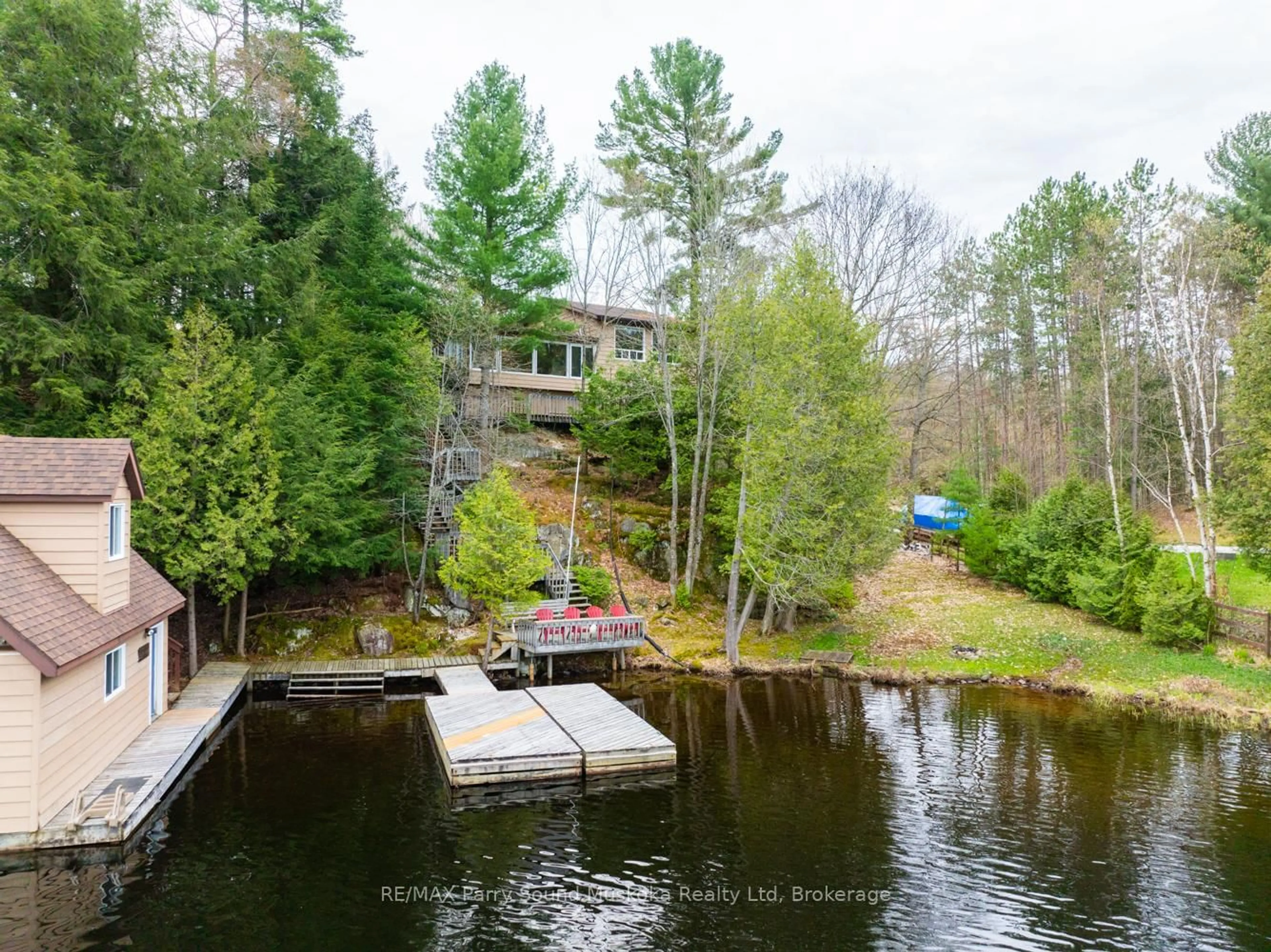 A pic from outside/outdoor area/front of a property/back of a property/a pic from drone, water/lake/river/ocean view for 17 Tapatoo Tr, Seguin Ontario P2A 2W8
