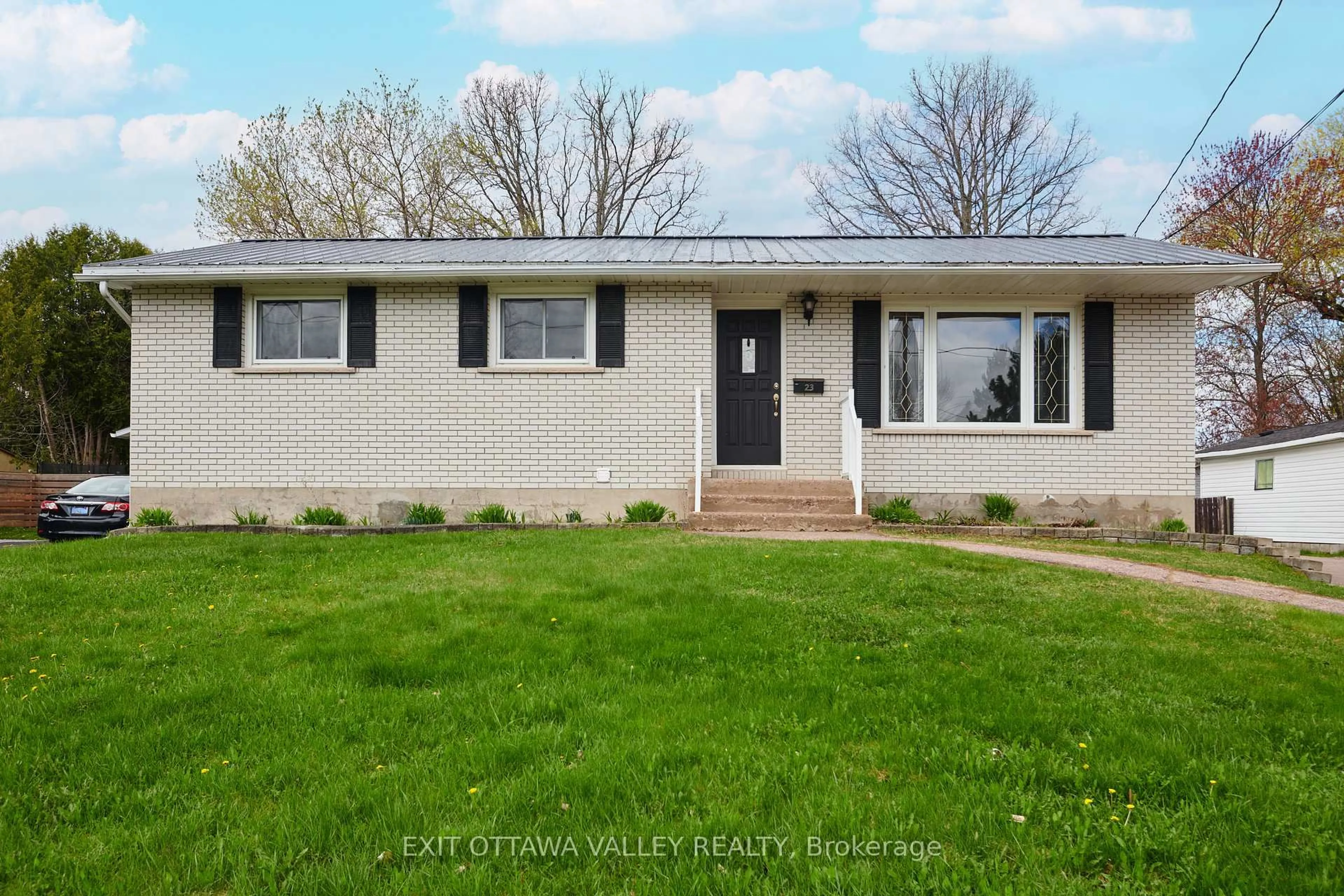Home with vinyl exterior material, street for 23 Doran Rd, Petawawa Ontario K8H 1P8