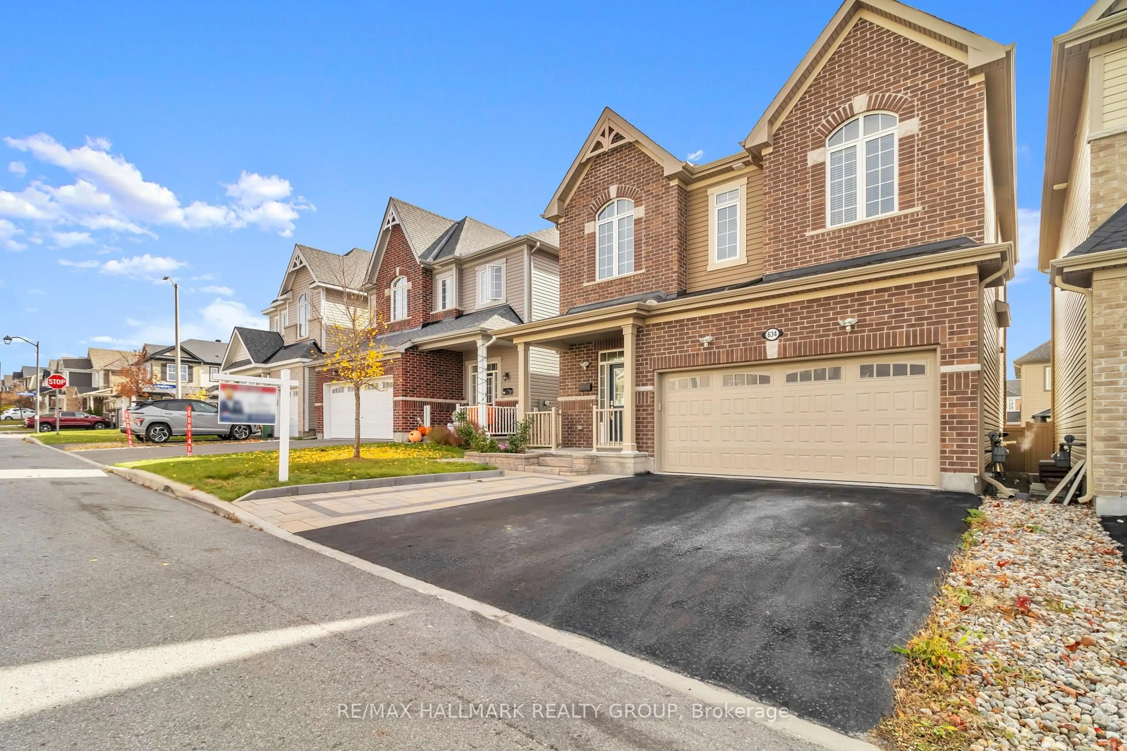 Home with brick exterior material, street for 634 SILVER SPRUCE Way, Ottawa Ontario K2M 0L2
