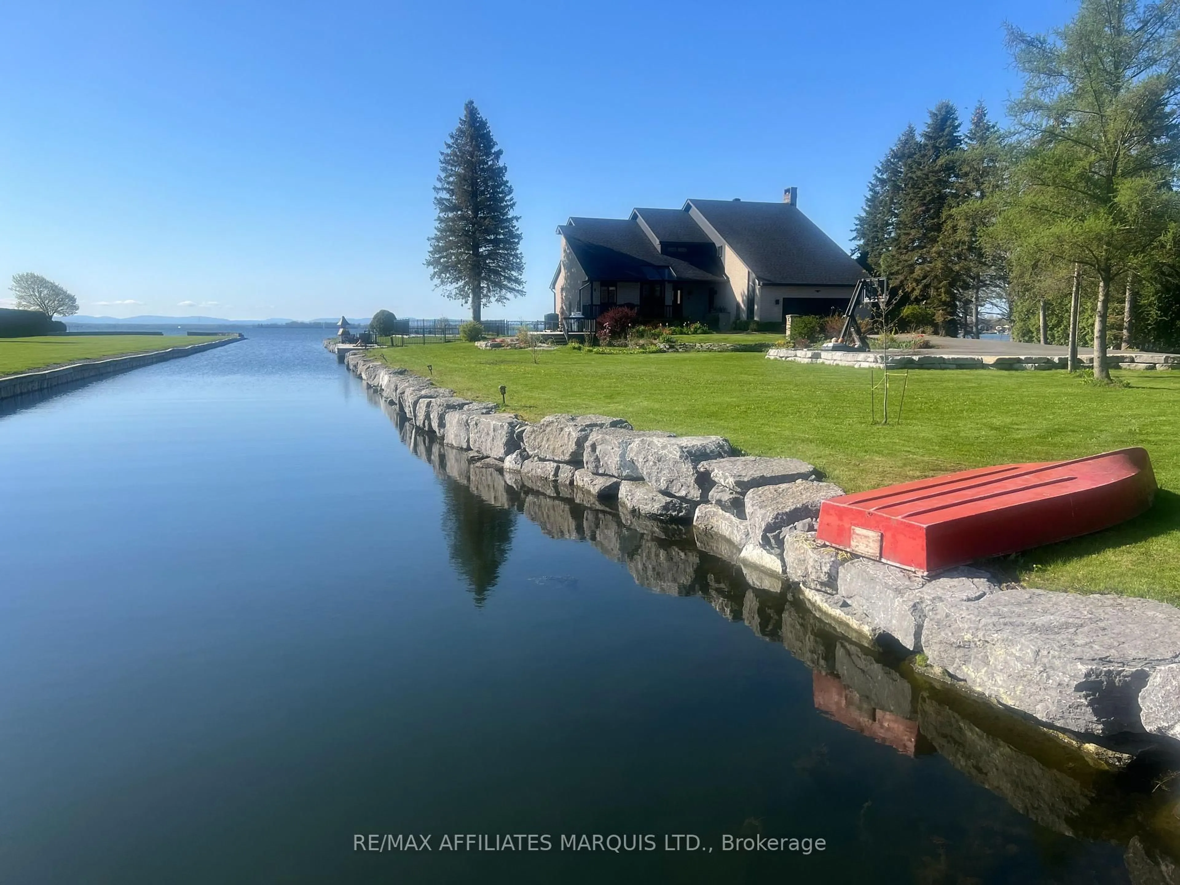 A pic from outside/outdoor area/front of a property/back of a property/a pic from drone, water/lake/river/ocean view for 20214 County Rd 2 Rd, South Glengarry Ontario K0C 2E0