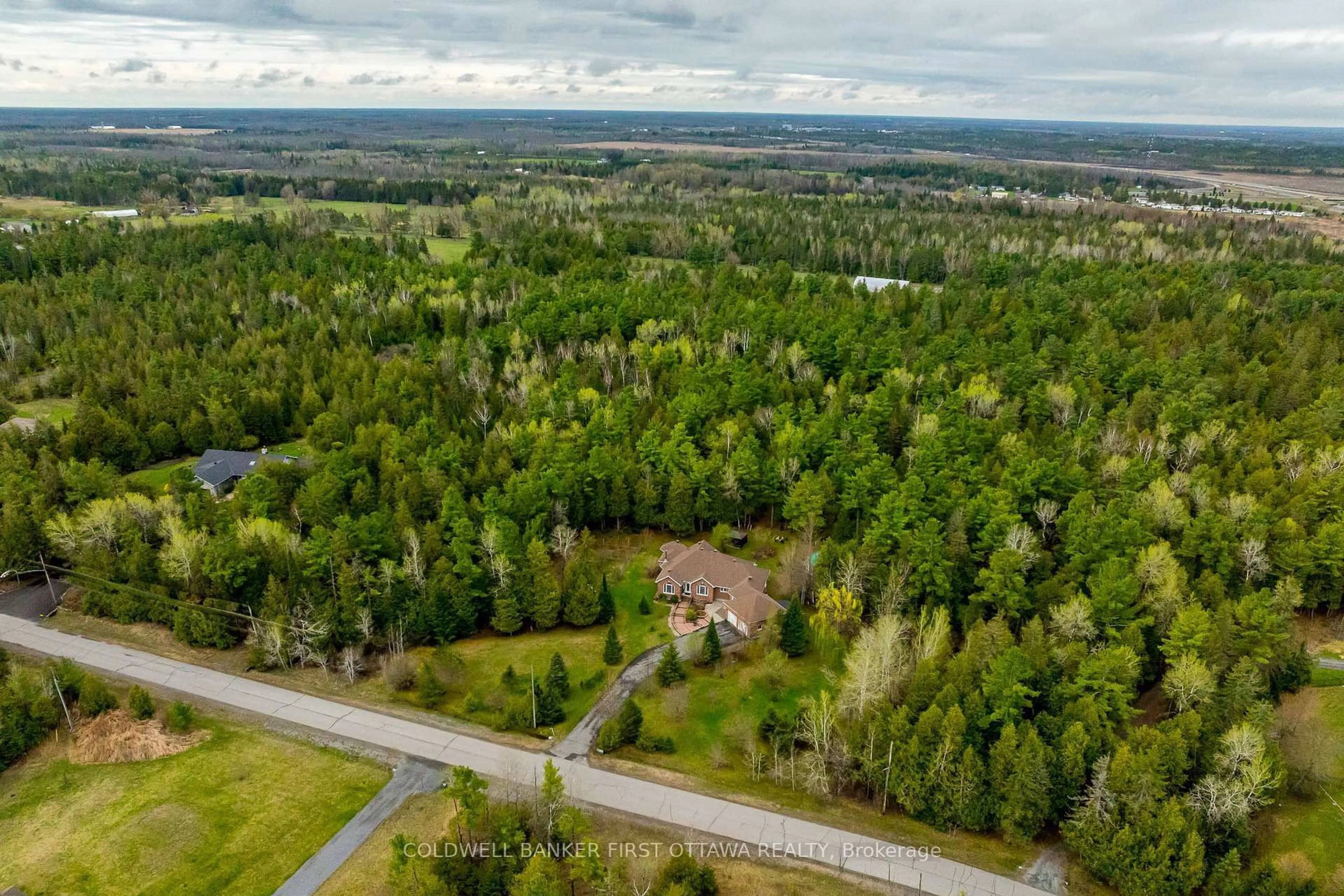 A pic from outside/outdoor area/front of a property/back of a property/a pic from drone, forest/trees view for 12 CARLISLE Circ, Ashton Ontario K0A 1B0