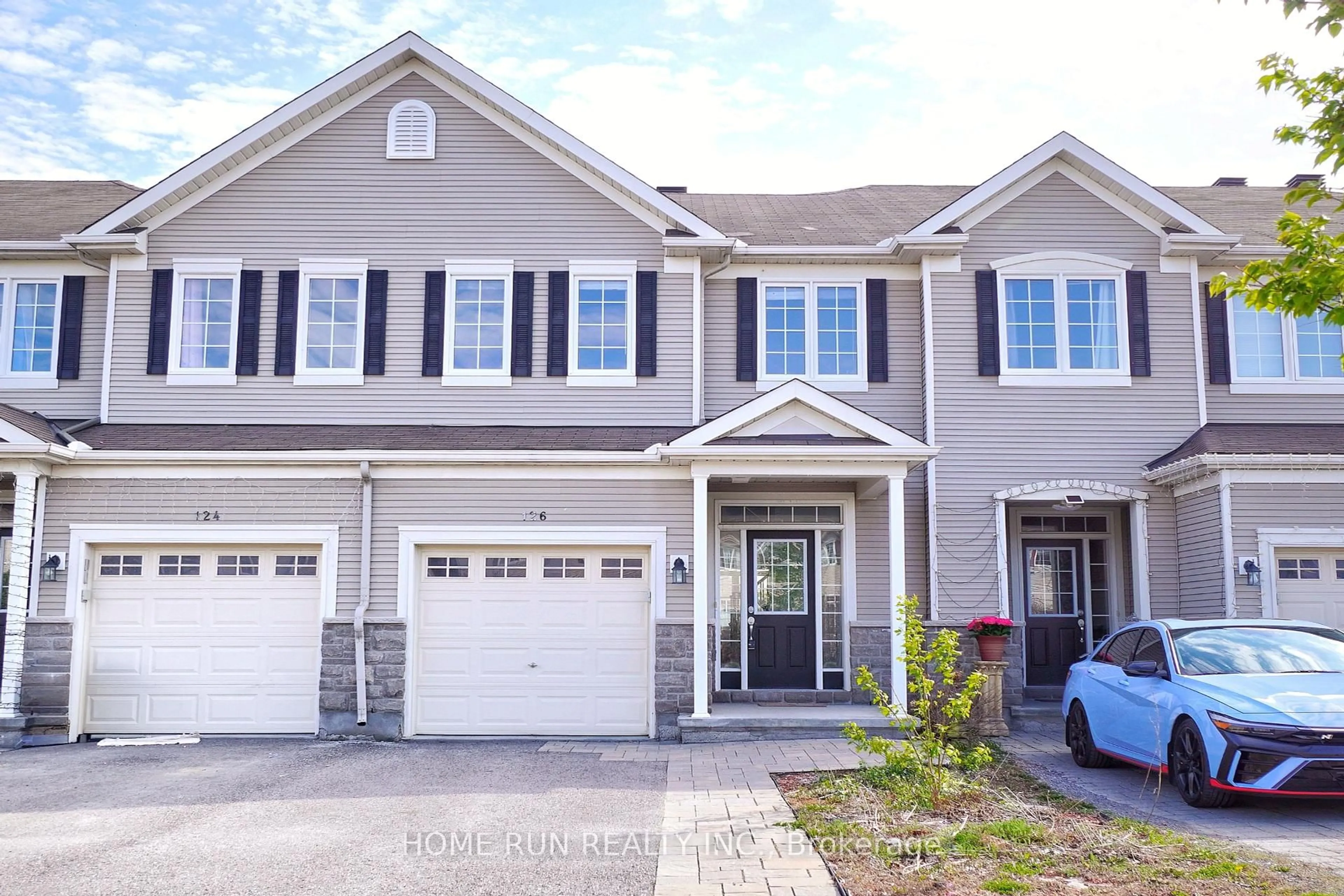 Home with vinyl exterior material, street for 126 Akerson Rd, Ottawa Ontario K2M 0B3