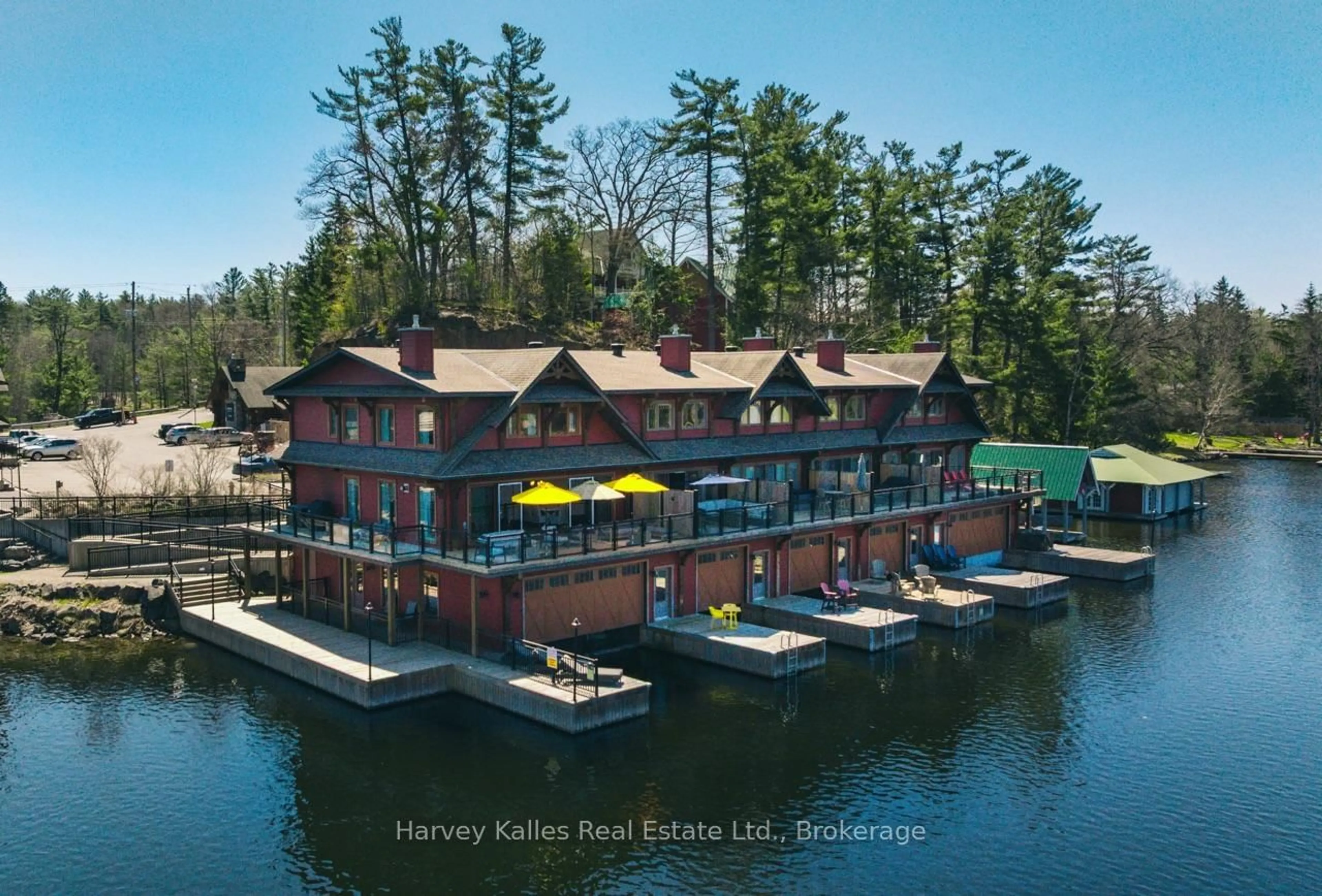 A pic from outside/outdoor area/front of a property/back of a property/a pic from drone, water/lake/river/ocean view for 97D Joseph St #206, Muskoka Lakes Ontario P0B 1J0