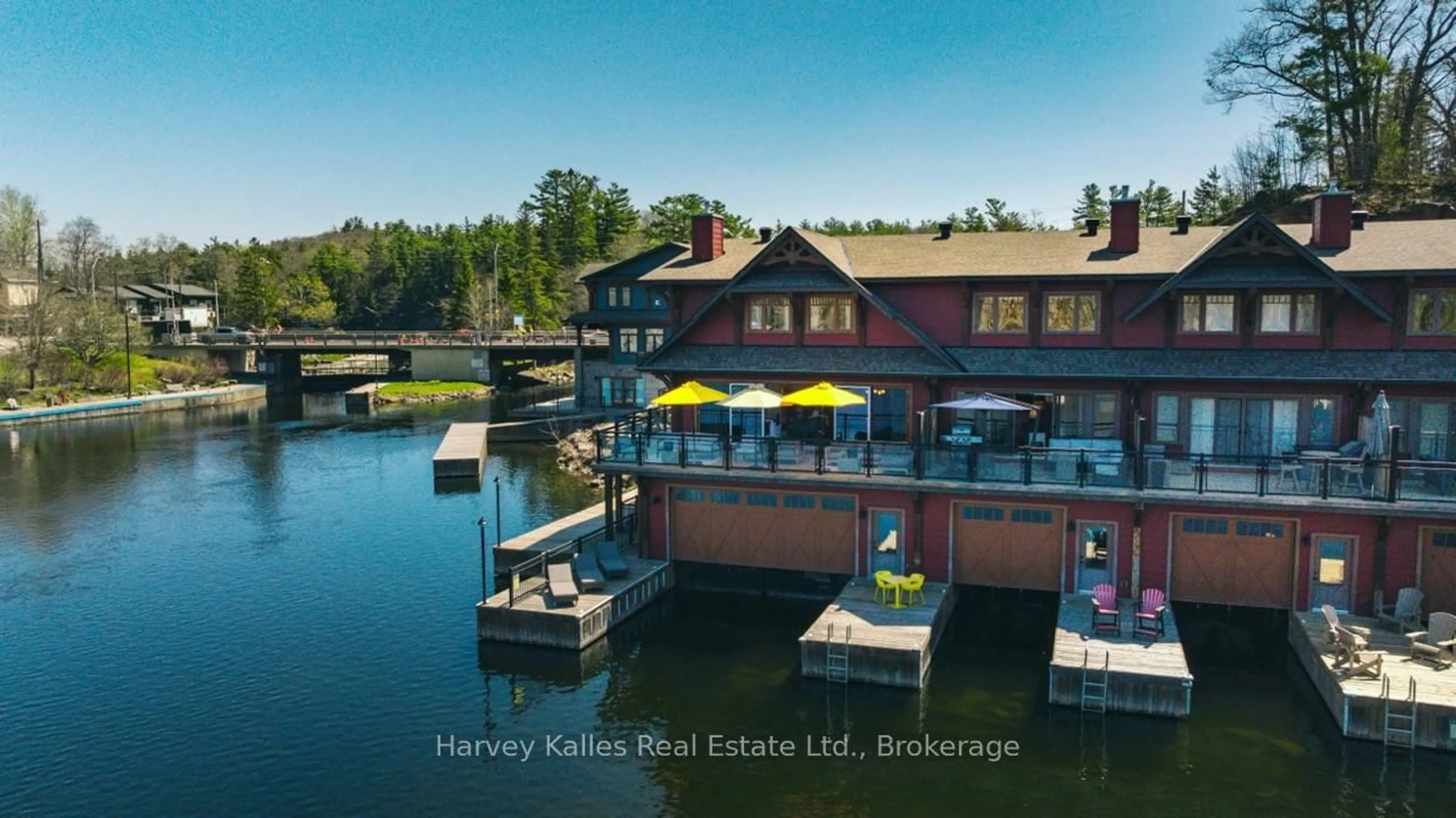 A pic from outside/outdoor area/front of a property/back of a property/a pic from drone, water/lake/river/ocean view for 97D Joseph St #206, Muskoka Lakes Ontario P0B 1J0
