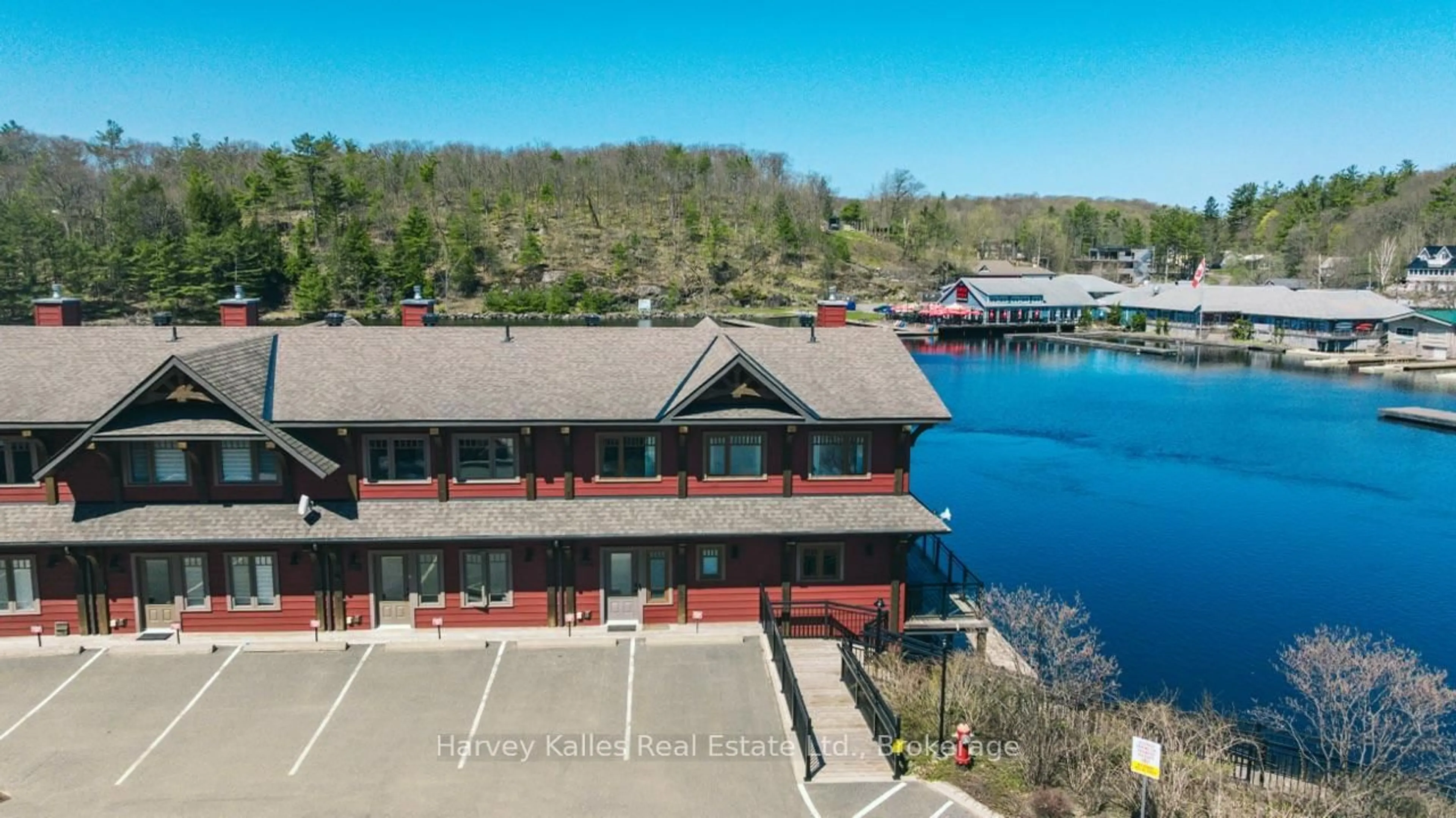 A pic from outside/outdoor area/front of a property/back of a property/a pic from drone, water/lake/river/ocean view for 97D Joseph St #206, Muskoka Lakes Ontario P0B 1J0