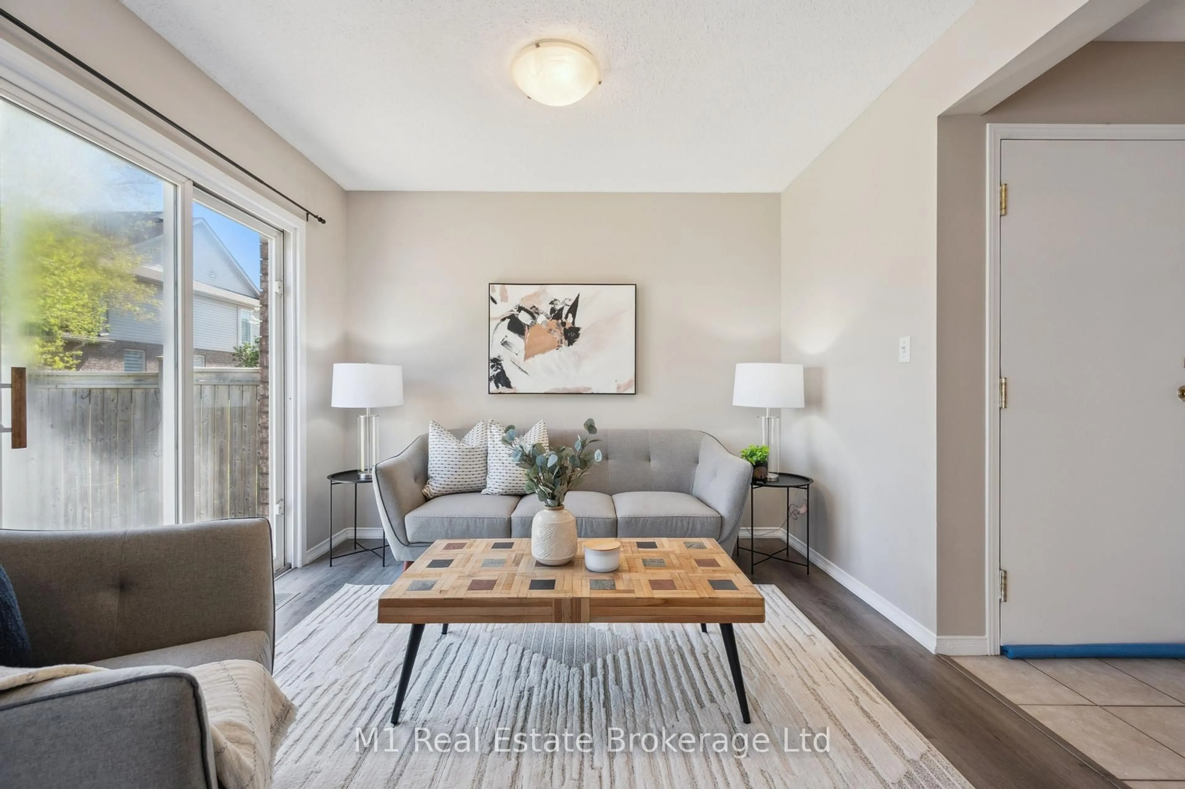 Living room with furniture, wood/laminate floor for 9 Eugene Dr, Guelph Ontario N1L 1P6