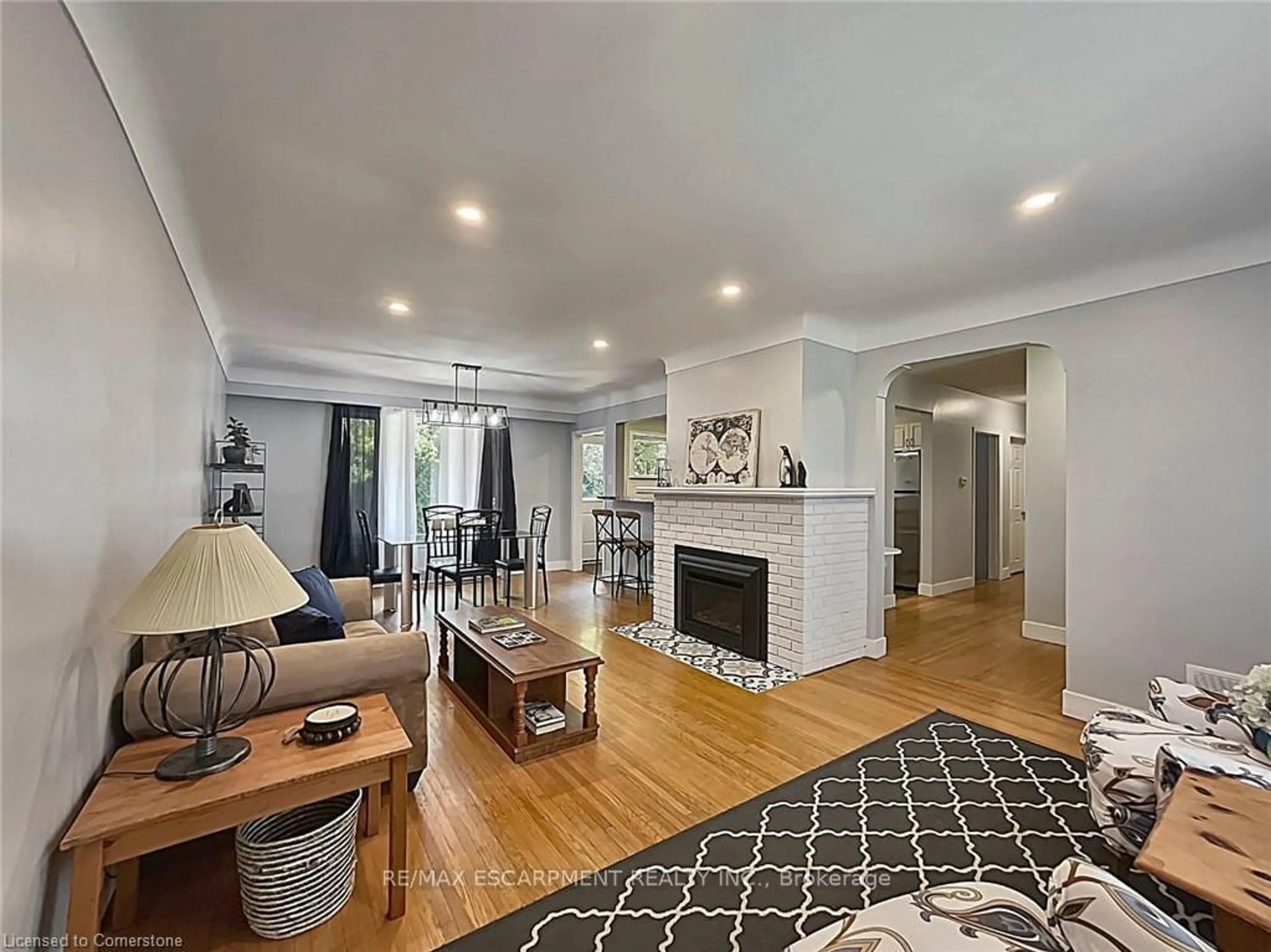Living room with furniture, wood/laminate floor for 31 Masterson Ave, St. Catharines Ontario L2T 3P2