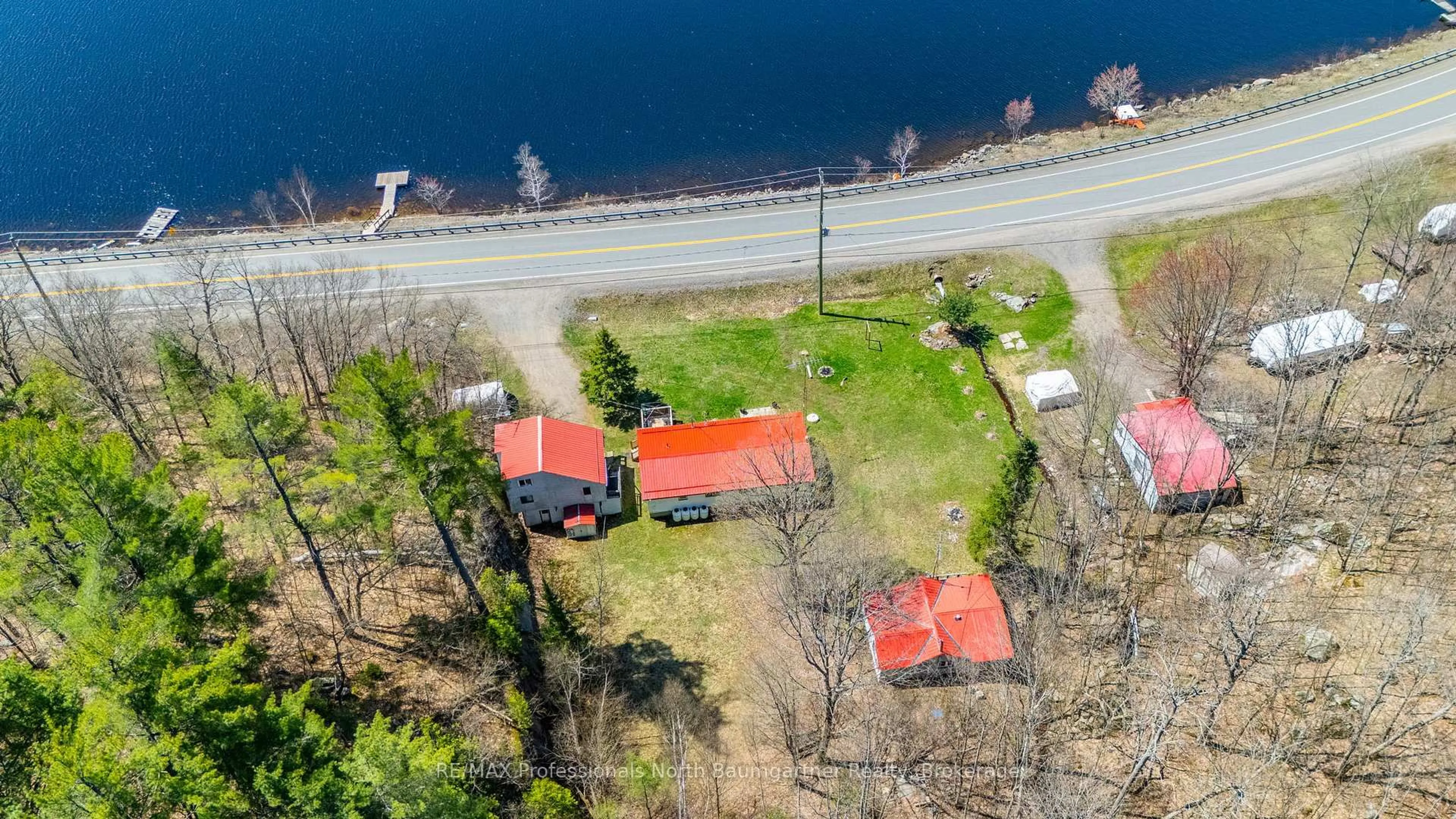 A pic from outside/outdoor area/front of a property/back of a property/a pic from drone, water/lake/river/ocean view for 18830 Hwy 35, Algonquin Highlands Ontario K0M 1J2