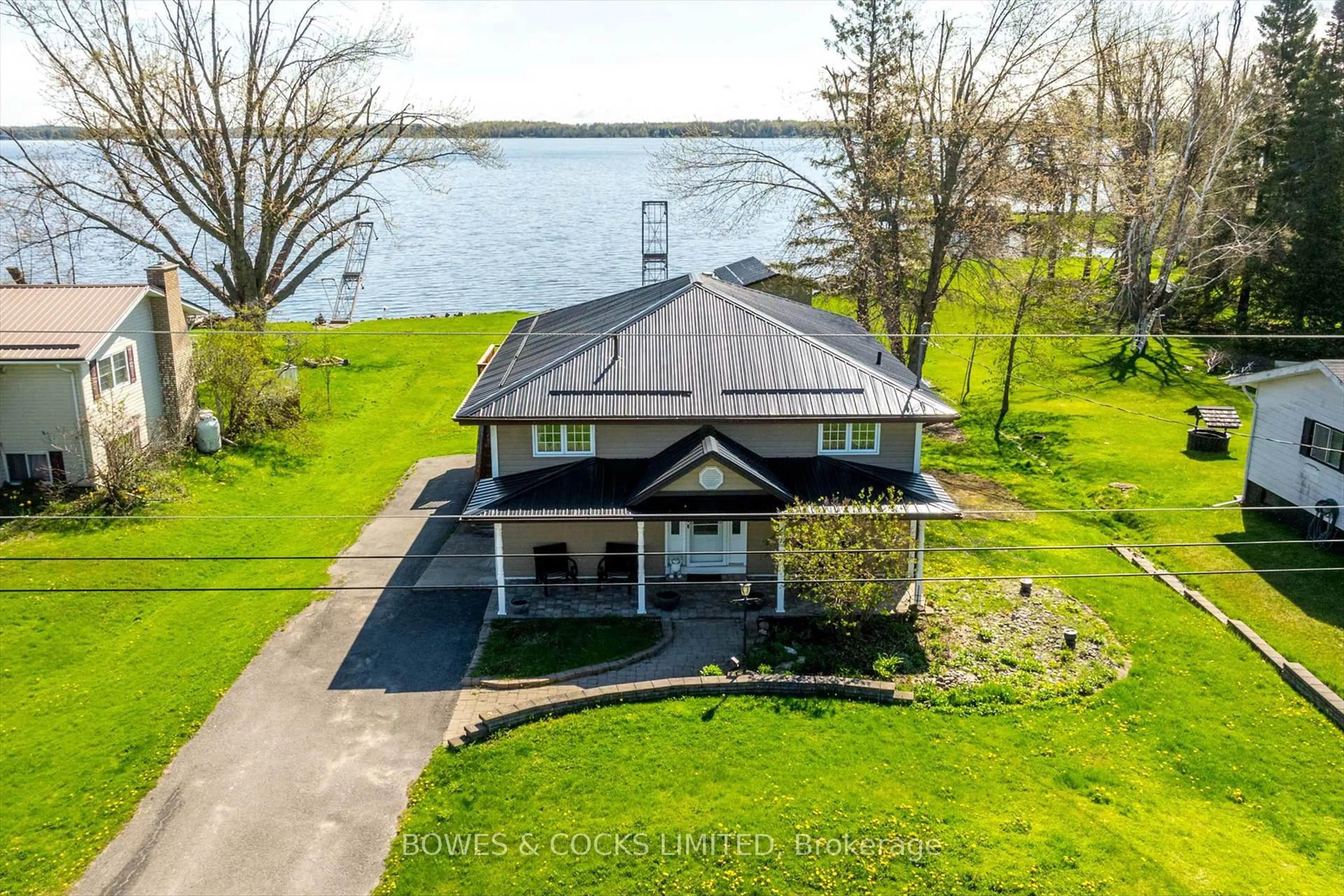 A pic from outside/outdoor area/front of a property/back of a property/a pic from drone, water/lake/river/ocean view for 240 Lakeshore Dr, Kawartha Lakes Ontario K0M 1A0