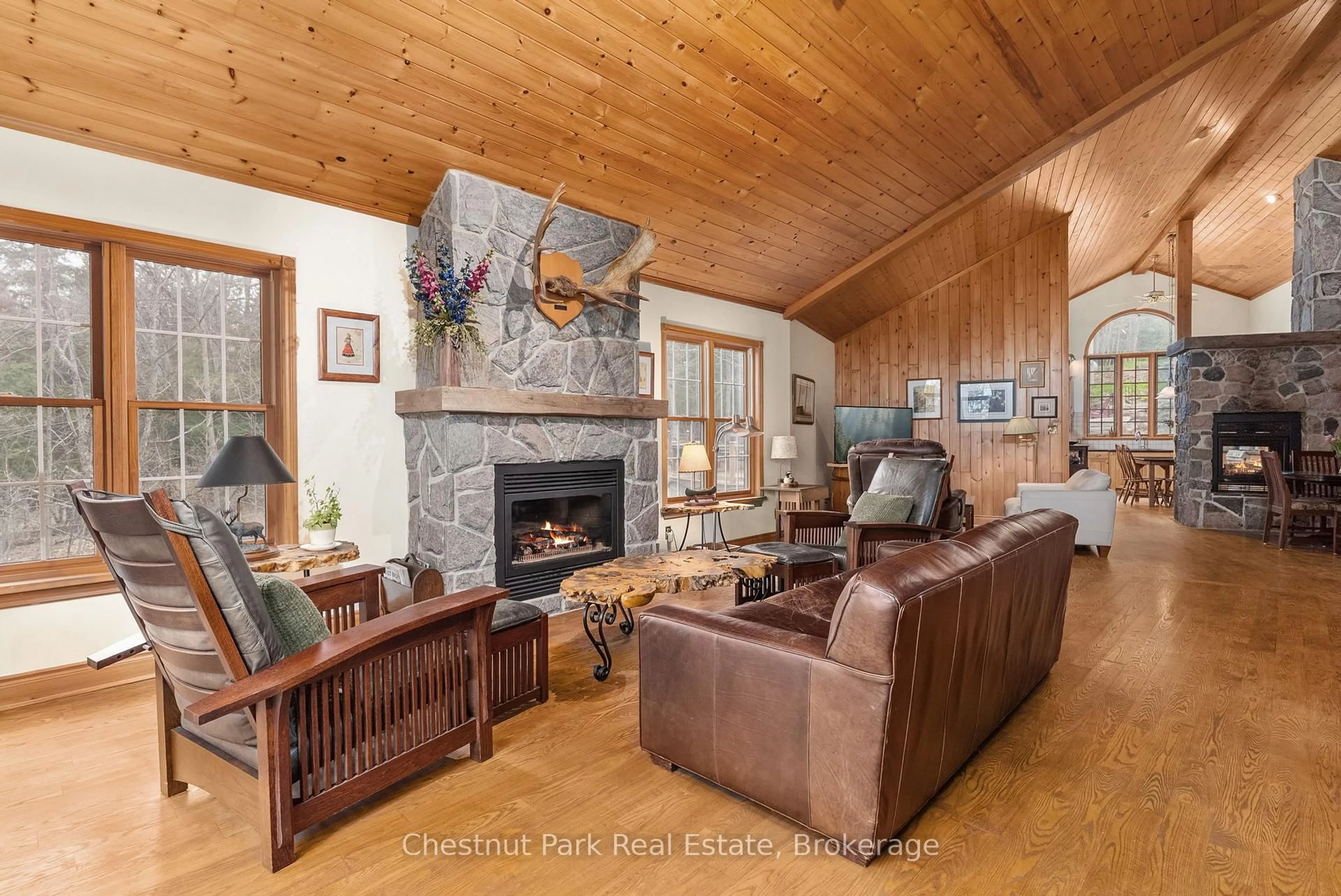 Living room with furniture, wood/laminate floor for 1143 Leonard Lake 1 Rd, Muskoka Lakes Ontario P1L 2G7