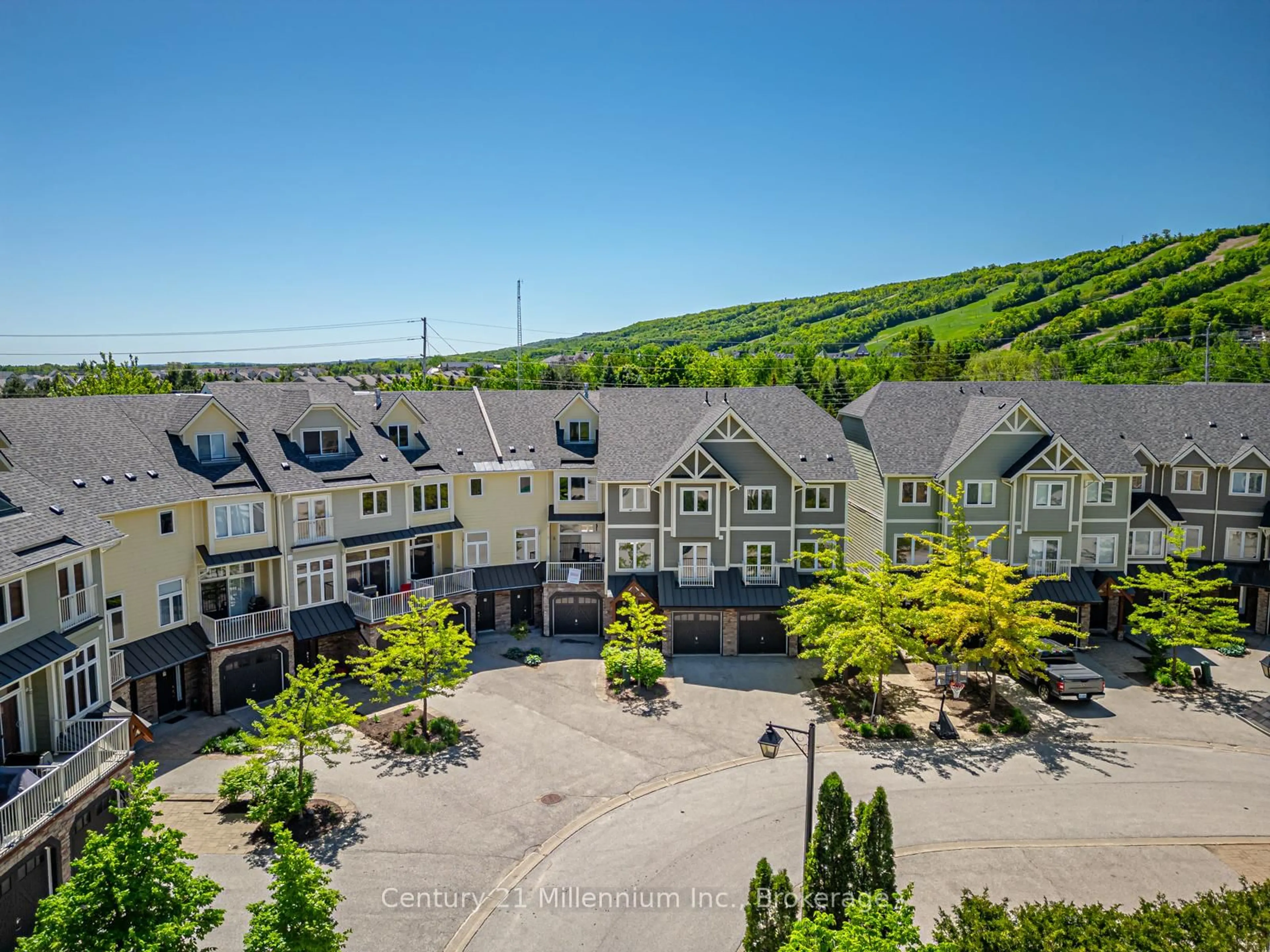 A pic from outside/outdoor area/front of a property/back of a property/a pic from drone, mountain view for 104 Farm Gate Rd #18, Blue Mountains Ontario L9Y 3Z2