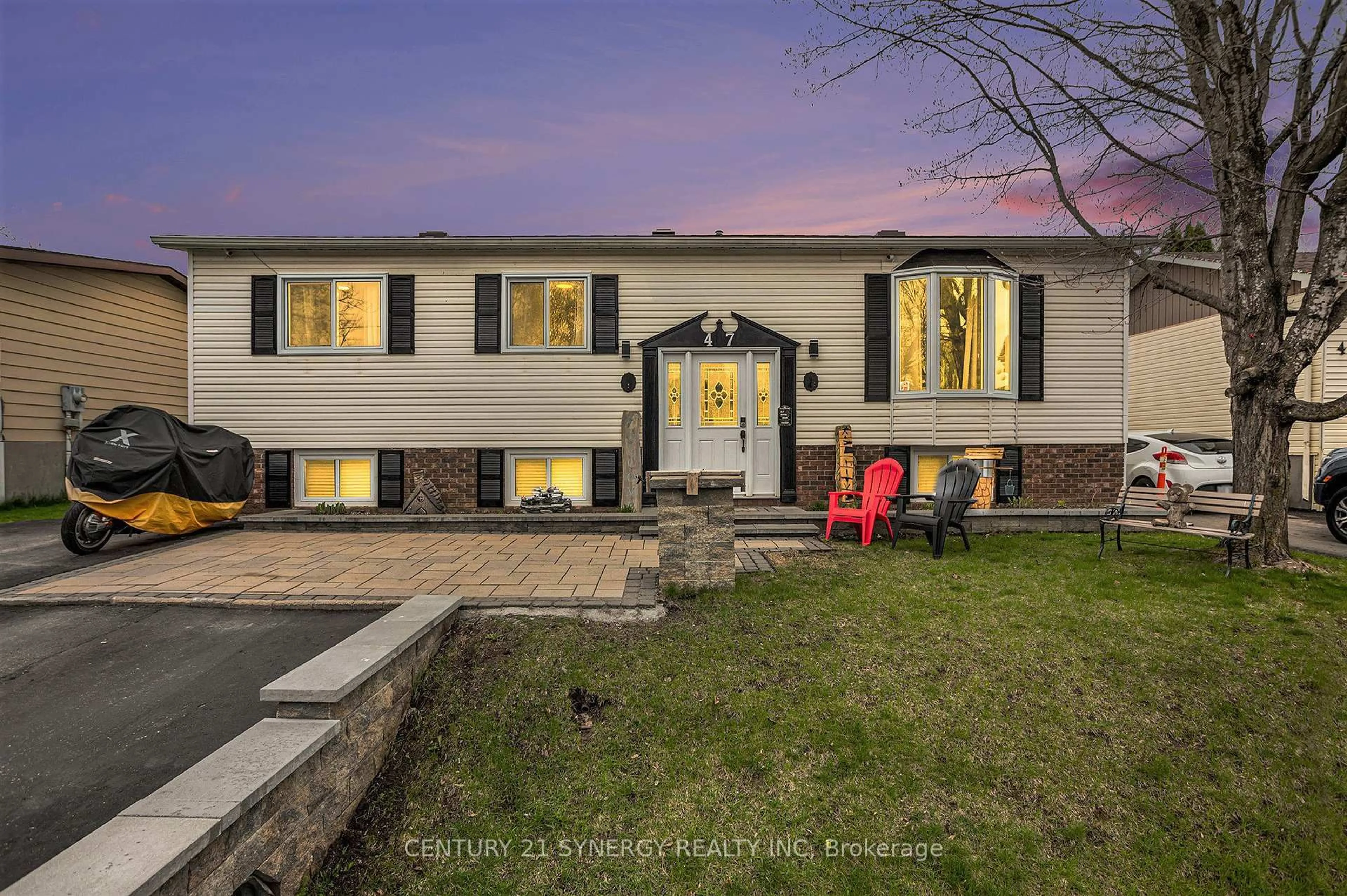 Home with vinyl exterior material, street for 47 Fringewood Dr, Ottawa Ontario K2S 1T8