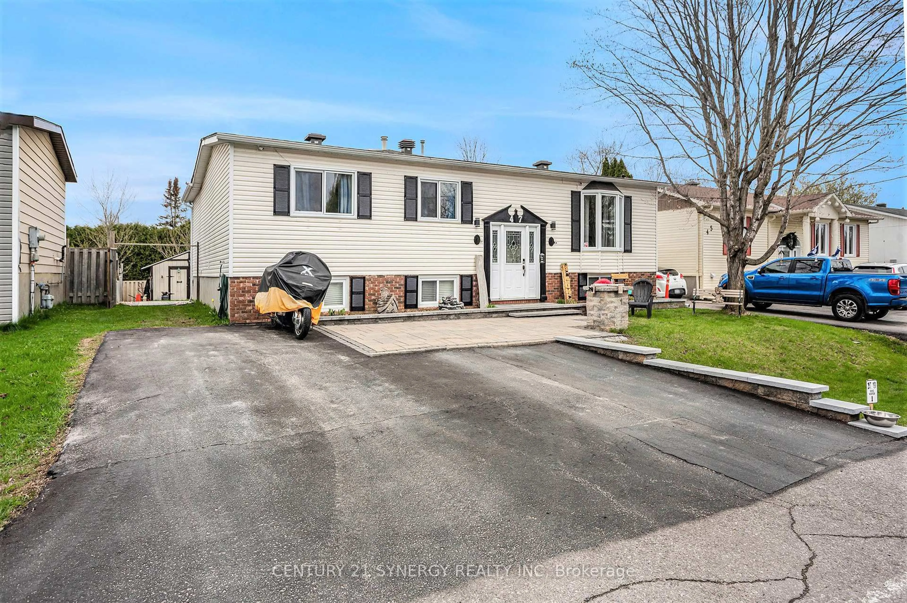 Home with vinyl exterior material, street for 47 Fringewood Dr, Ottawa Ontario K2S 1T8