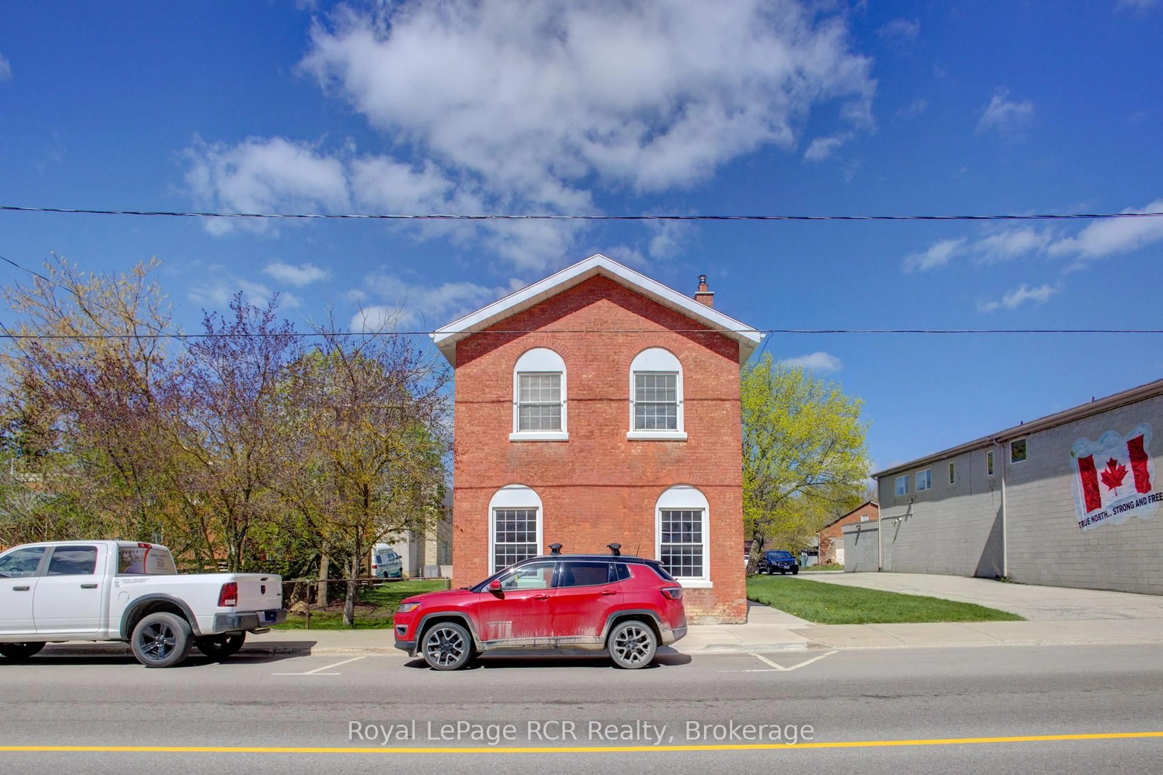 Home with brick exterior material, building for 221 George St, Wellington North Ontario N0G 1A0