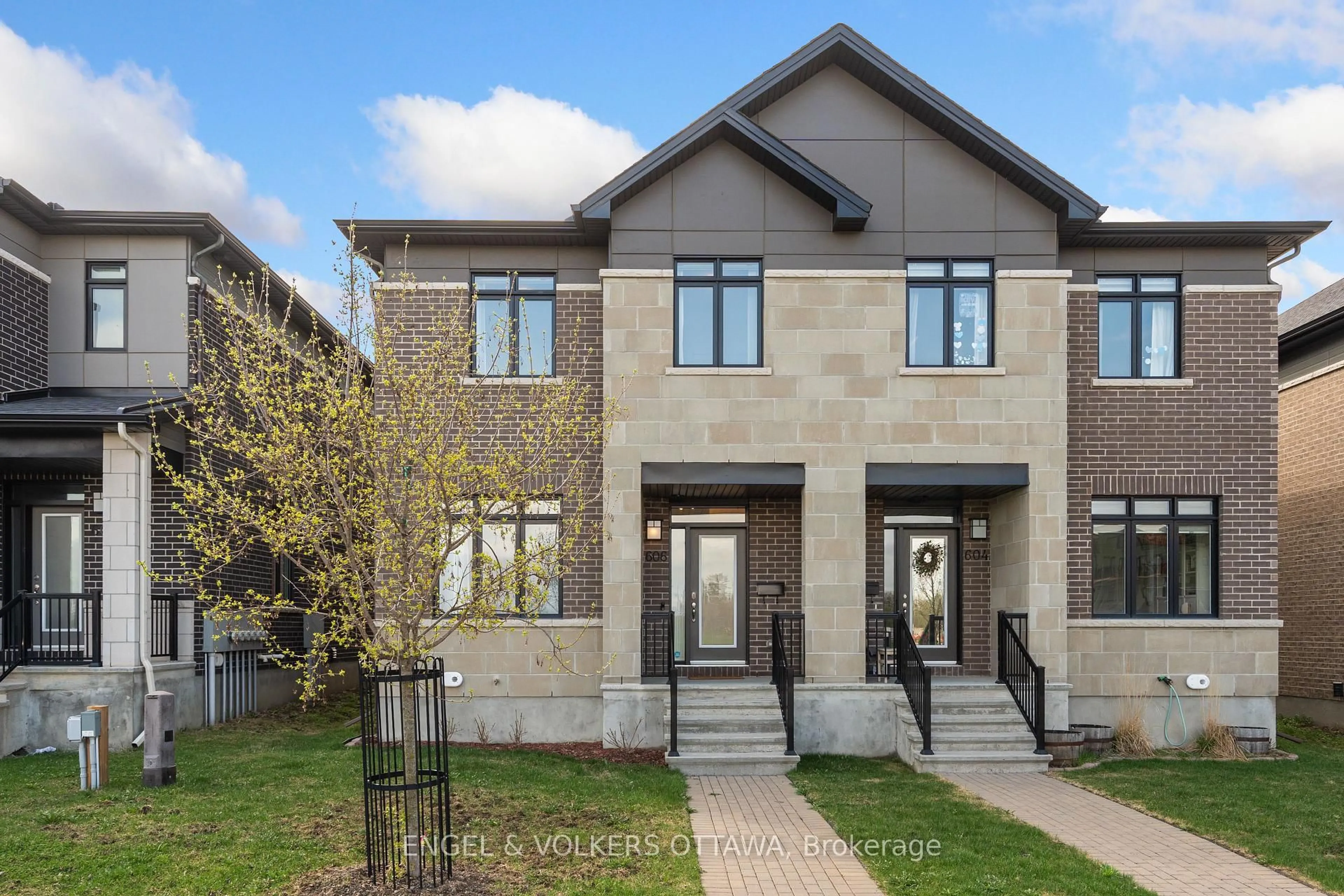Home with brick exterior material, street for 606 Mikinak Rd, Ottawa Ontario K1K 3X7