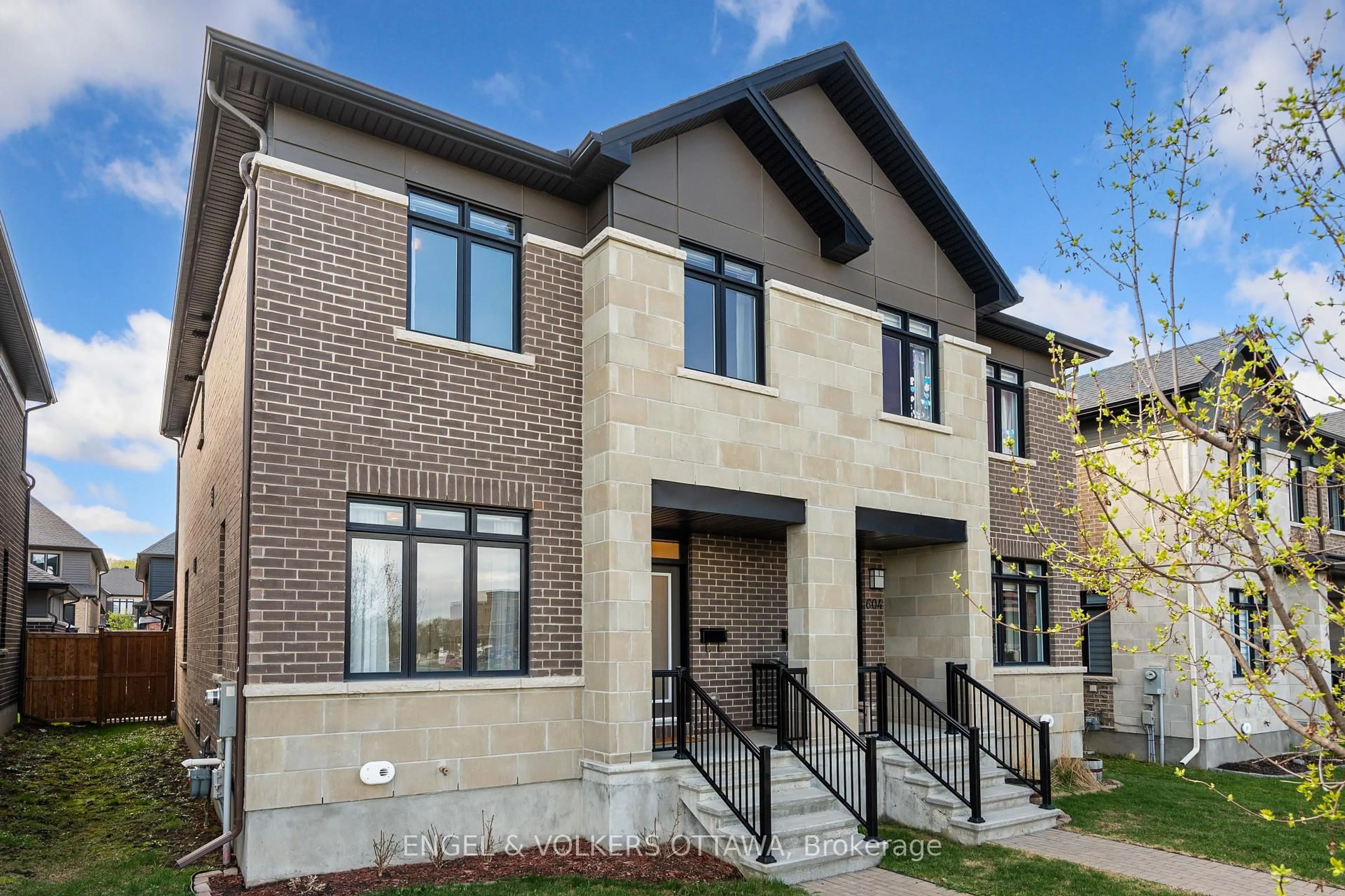 Home with brick exterior material, street for 606 Mikinak Rd, Ottawa Ontario K1K 3X7