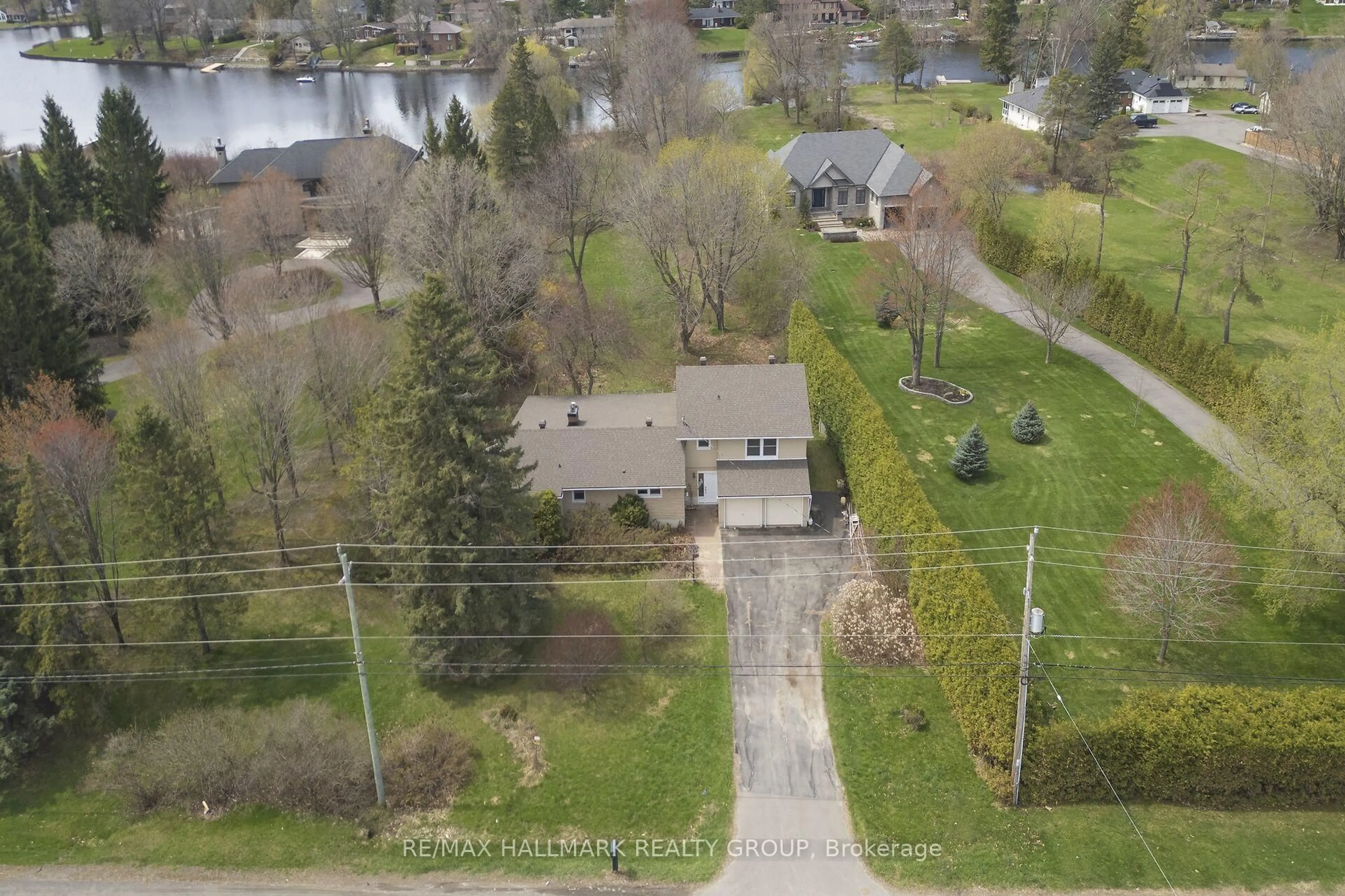 A pic from outside/outdoor area/front of a property/back of a property/a pic from drone, water/lake/river/ocean view for 1236 River Rd, Ottawa Ontario K4M 1B4