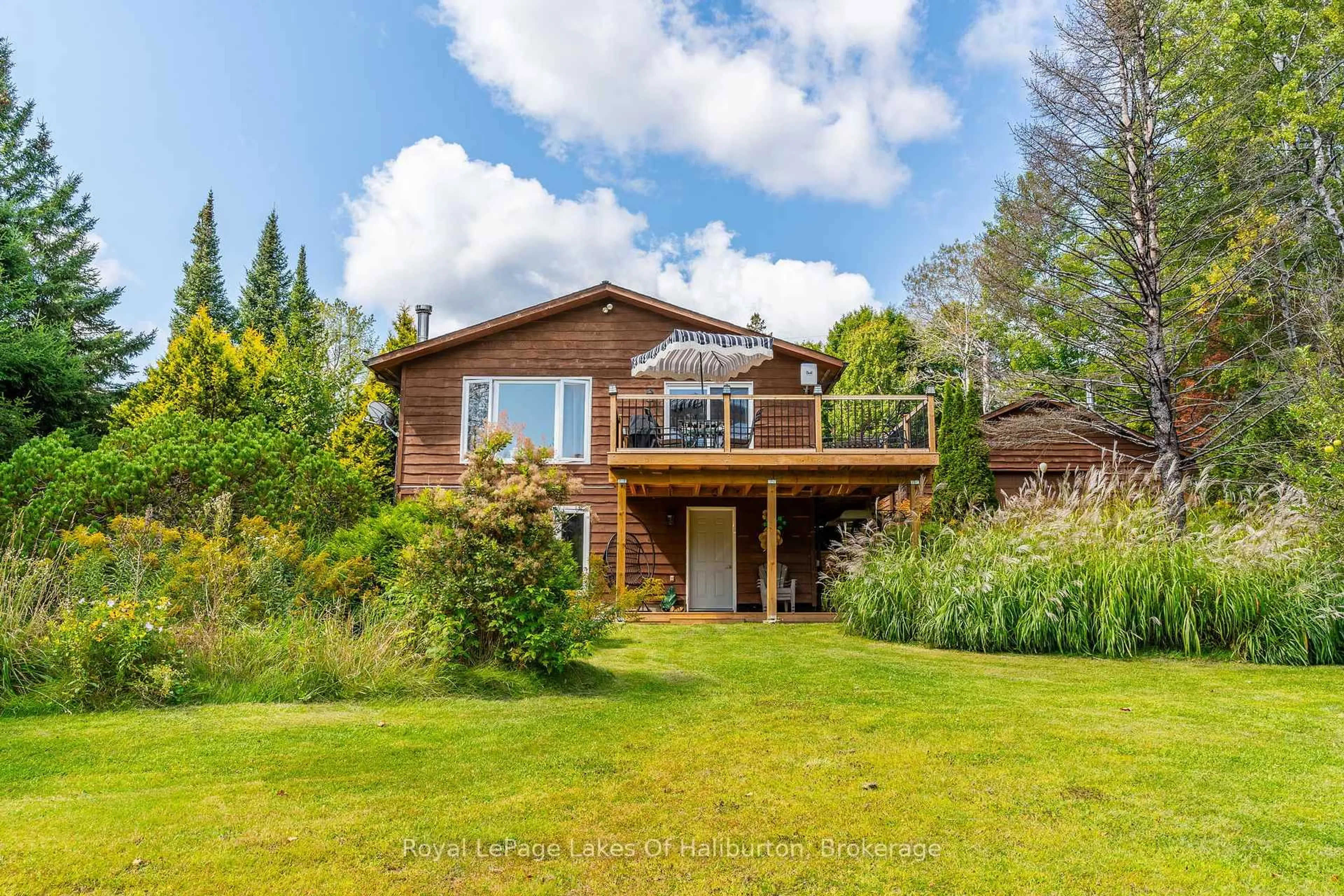 A pic from outside/outdoor area/front of a property/back of a property/a pic from drone, water/lake/river/ocean view for 1117 MISTIVALE Rd, Minden Hills Ontario K0M 2K0