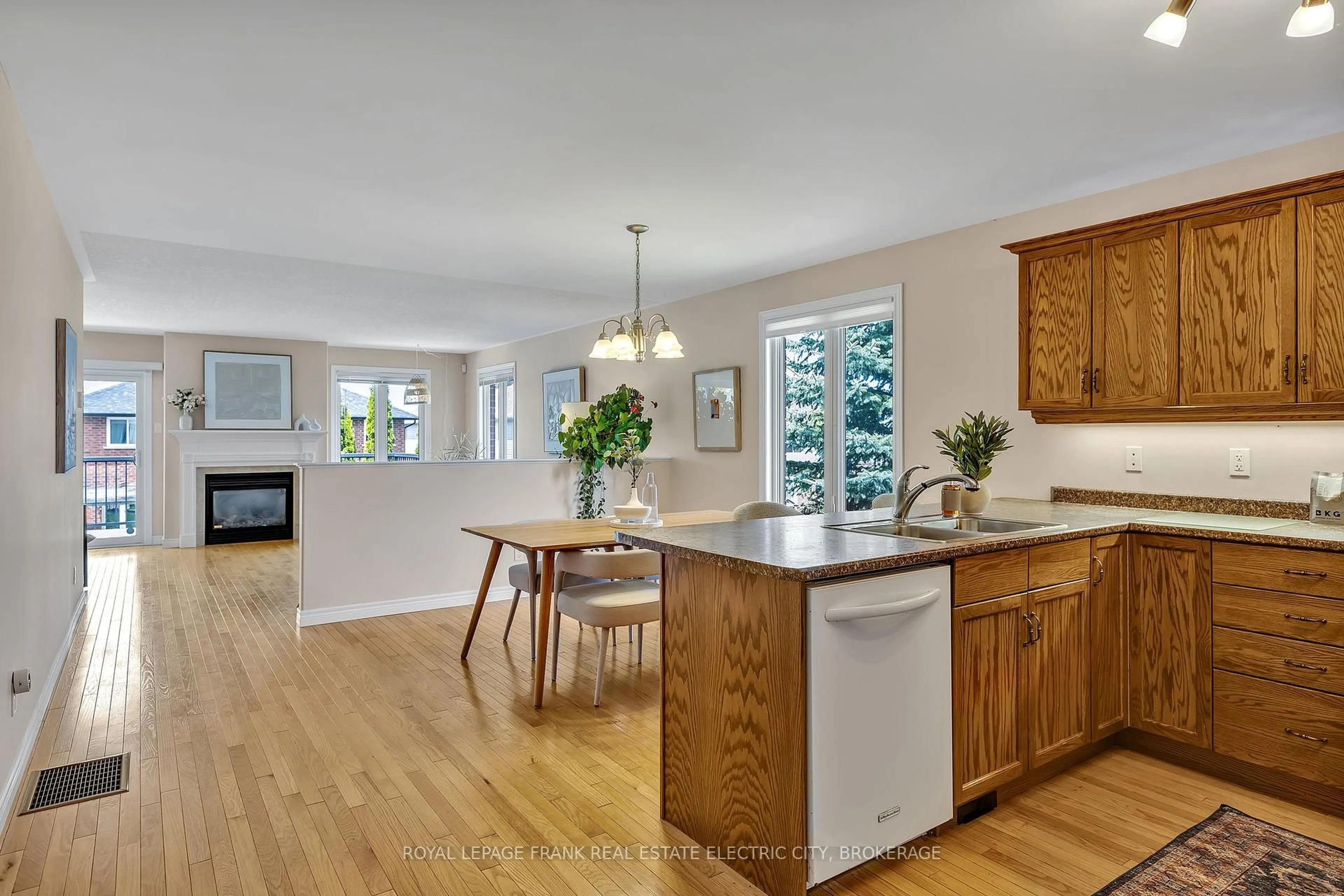 Open concept kitchen, wood/laminate floor for 1232 Scollard Dr, Peterborough East Ontario K9H 0A8