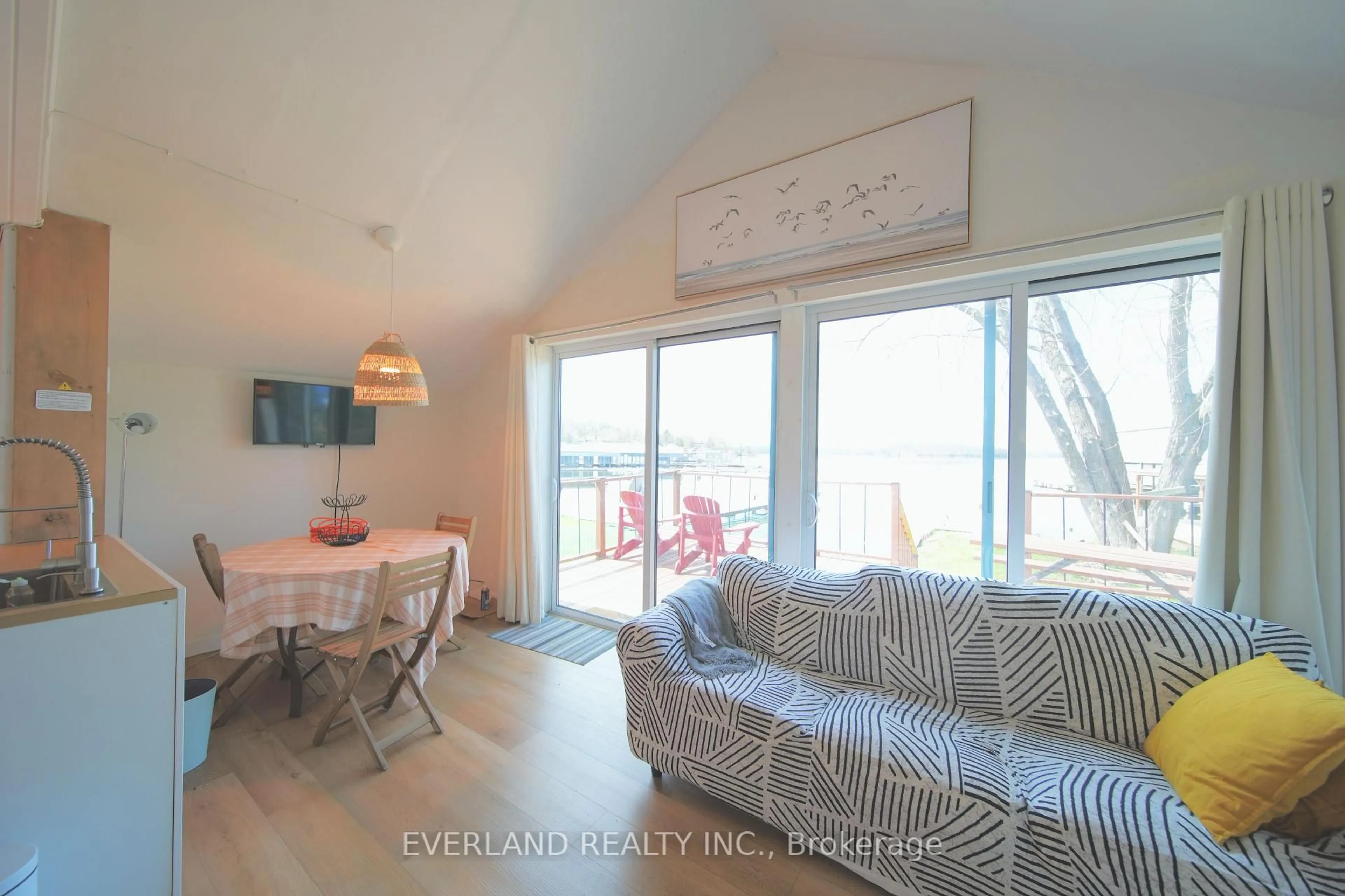 Living room with furniture, wood/laminate floor for 5308 Rice Lake Scenic Dr #120, Hamilton Township Ontario K0L 1E0