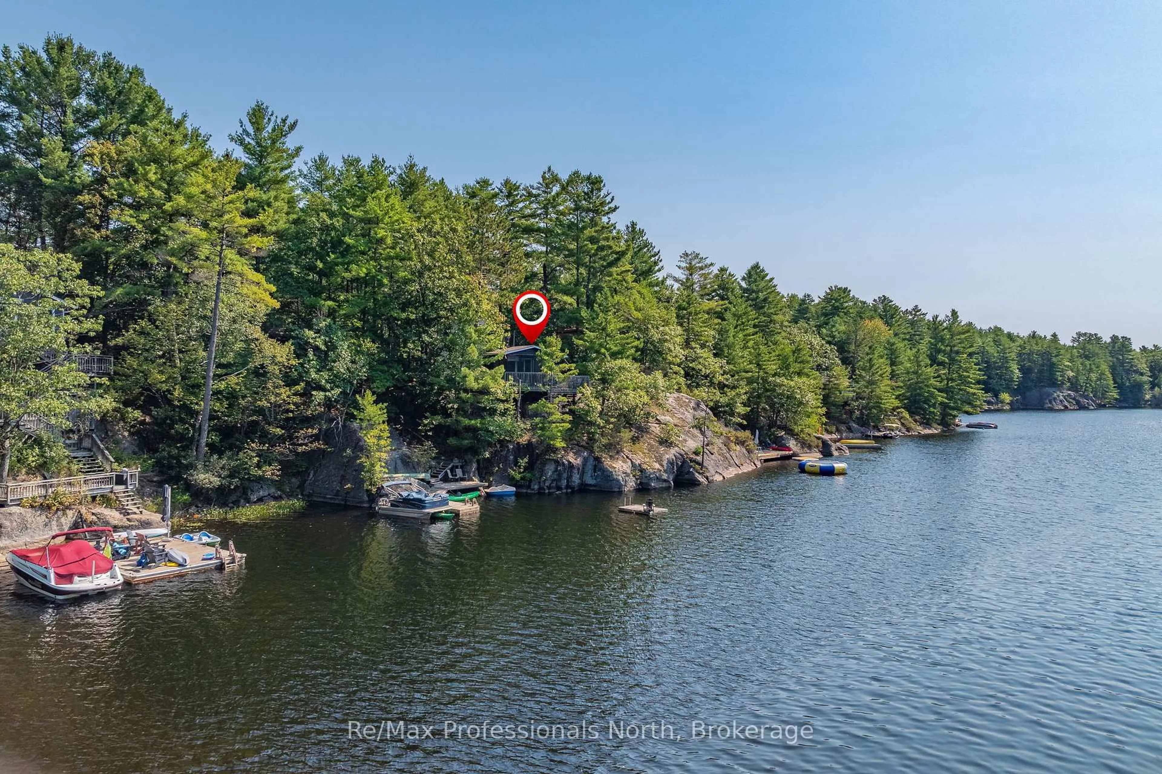 A pic from outside/outdoor area/front of a property/back of a property/a pic from drone, water/lake/river/ocean view for 1118 Tomingas Rd, Gravenhurst Ontario P1P 0G3