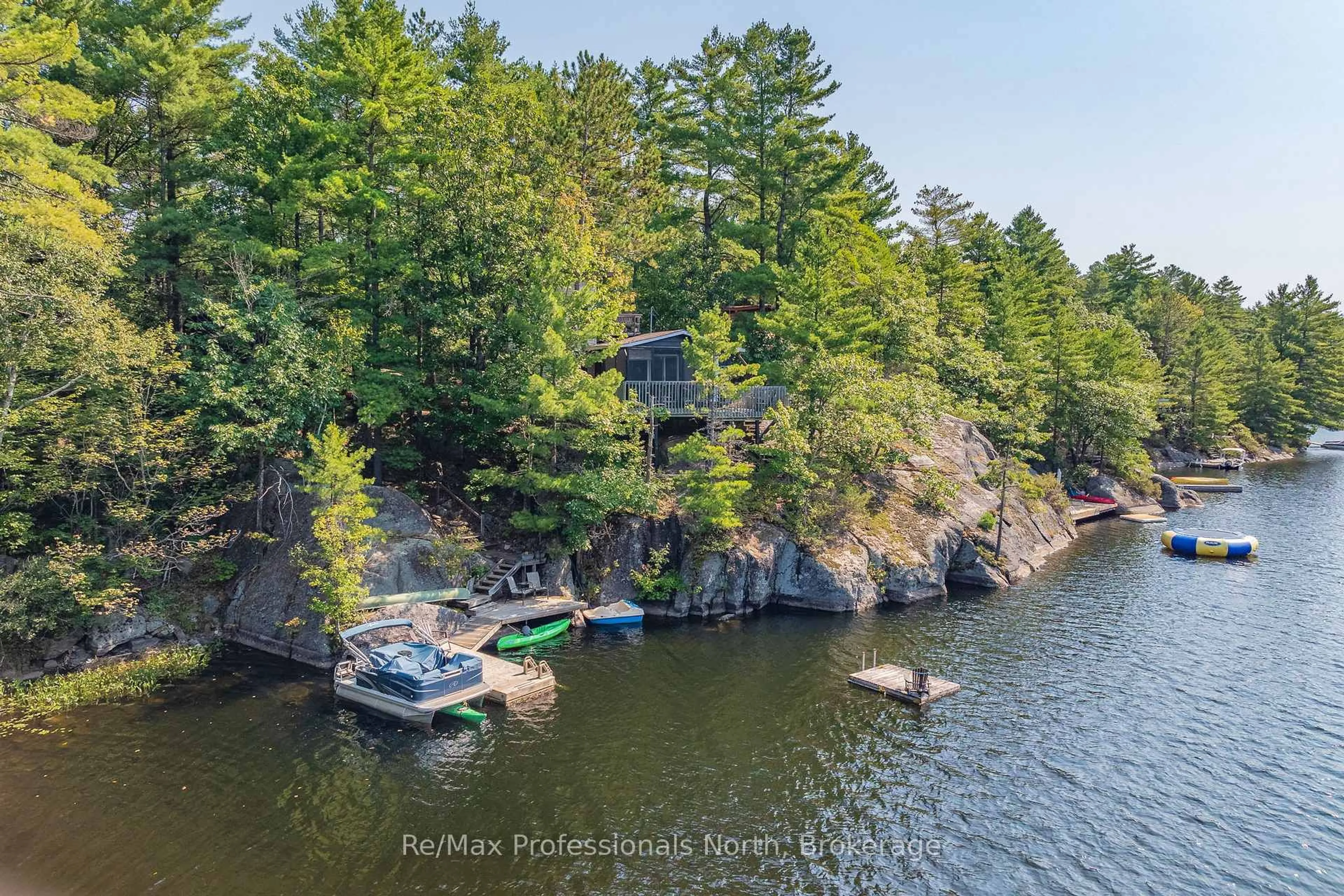 A pic from outside/outdoor area/front of a property/back of a property/a pic from drone, water/lake/river/ocean view for 1118 Tomingas Rd, Gravenhurst Ontario P1P 0G3