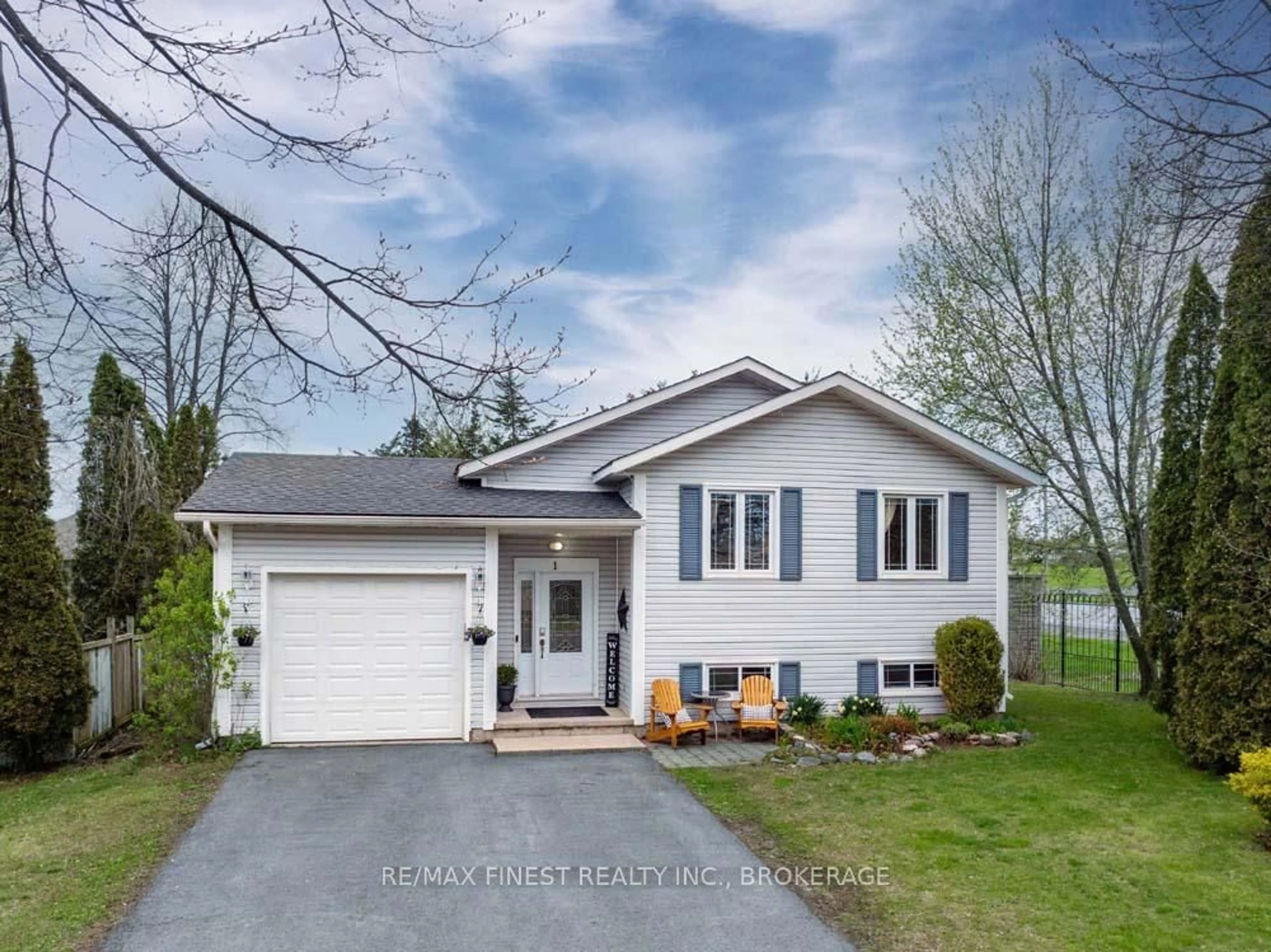 Home with vinyl exterior material, street for 1 Heritage Dr, Bath Ontario K0H 1G0