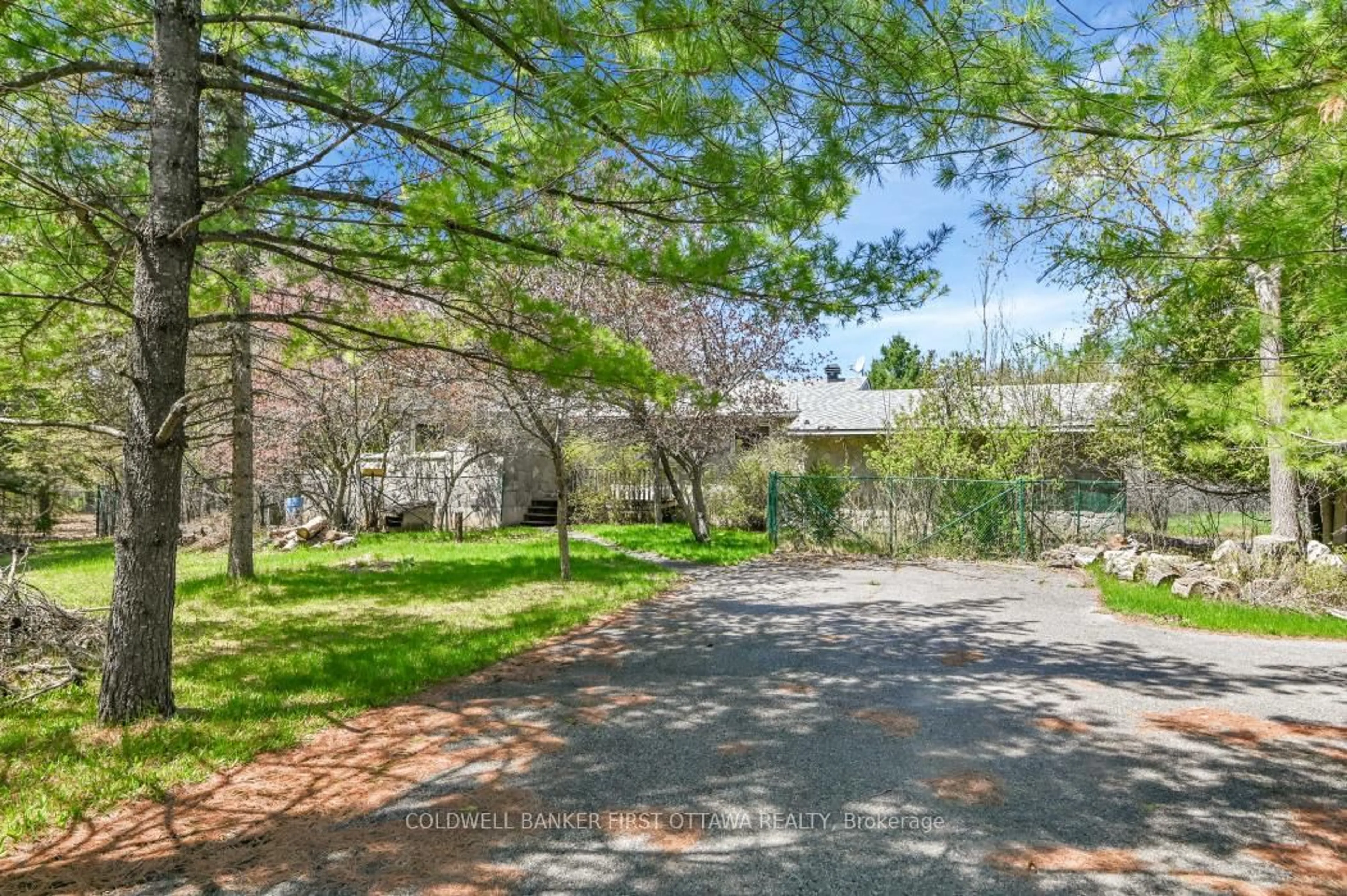 A pic from outside/outdoor area/front of a property/back of a property/a pic from drone, street for 135 Manion Rd, Carp Ontario K0A 1L0