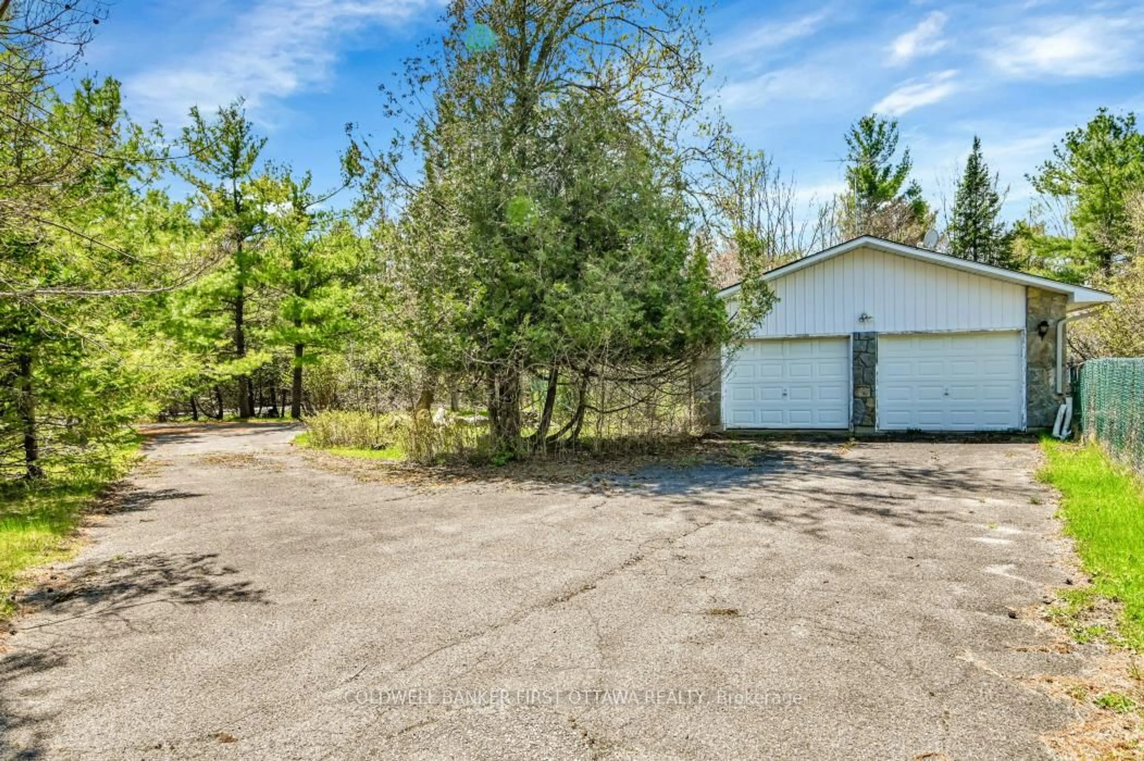 A pic from outside/outdoor area/front of a property/back of a property/a pic from drone, unknown for 135 Manion Rd, Carp Ontario K0A 1L0