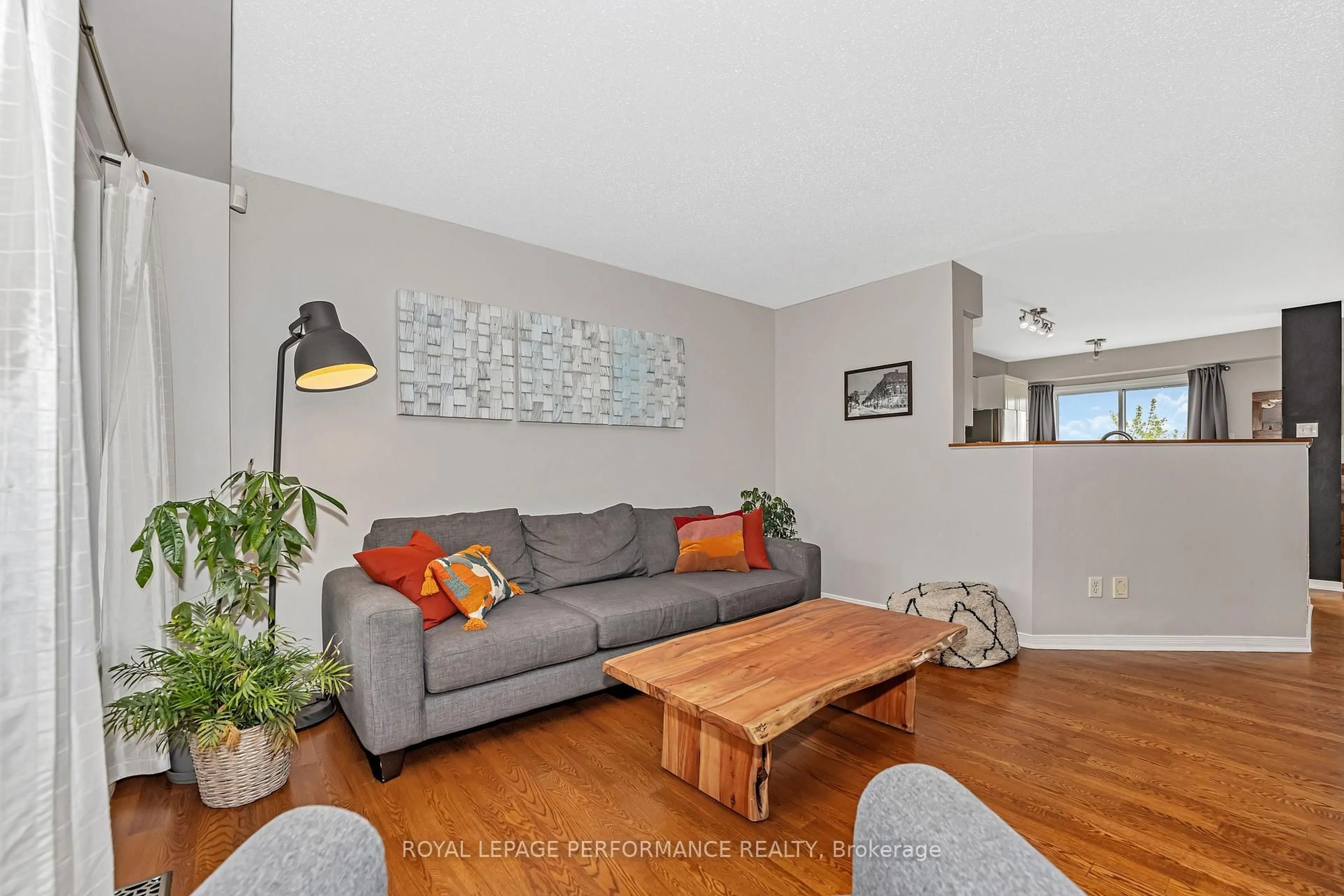 Living room with furniture, wood/laminate floor for 40 Carwood Circ, Ottawa Ontario K1K 4V4