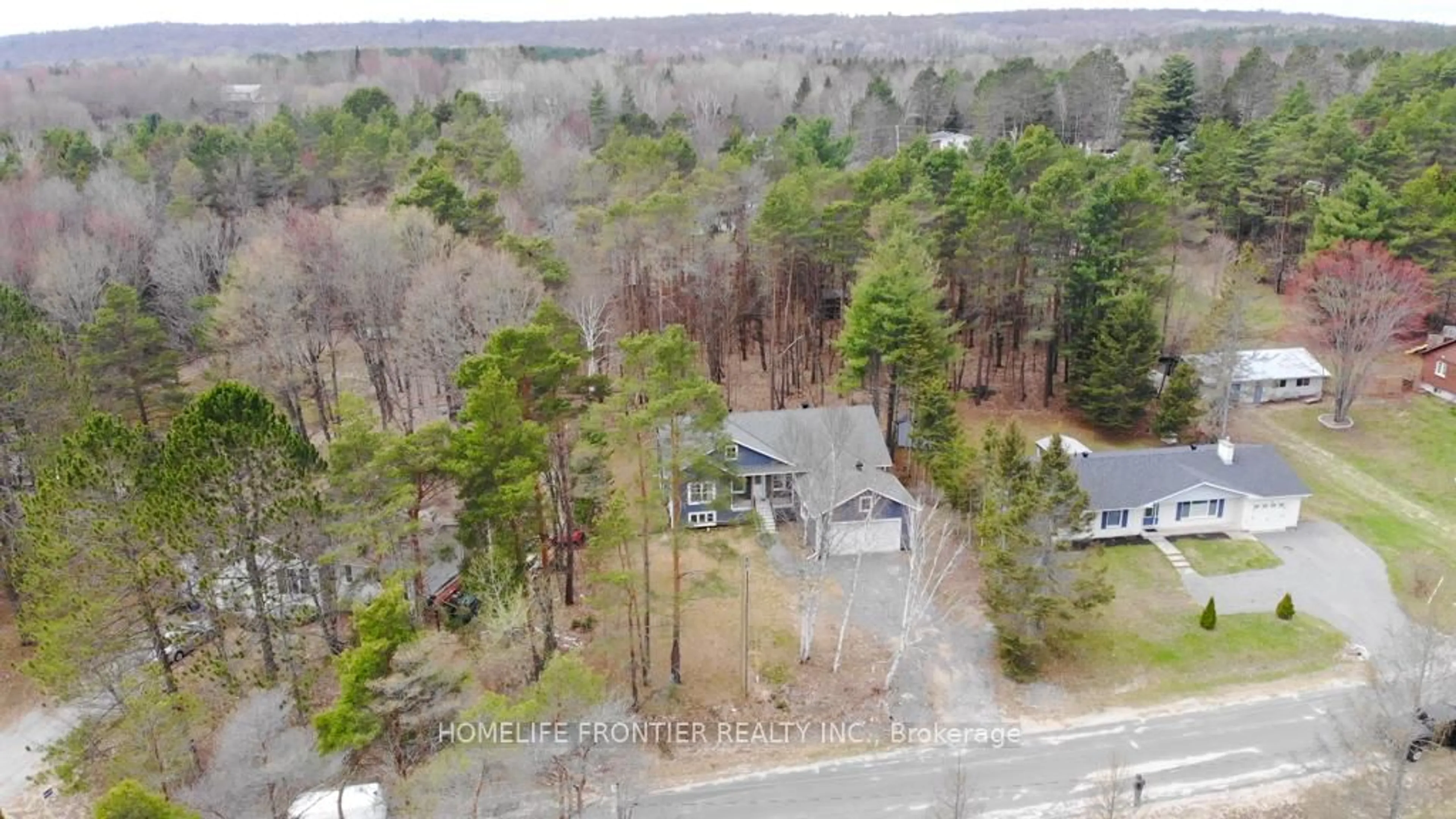 A pic from outside/outdoor area/front of a property/back of a property/a pic from drone, forest/trees view for 18 Murray St, Sundridge Ontario P0A 1Z0