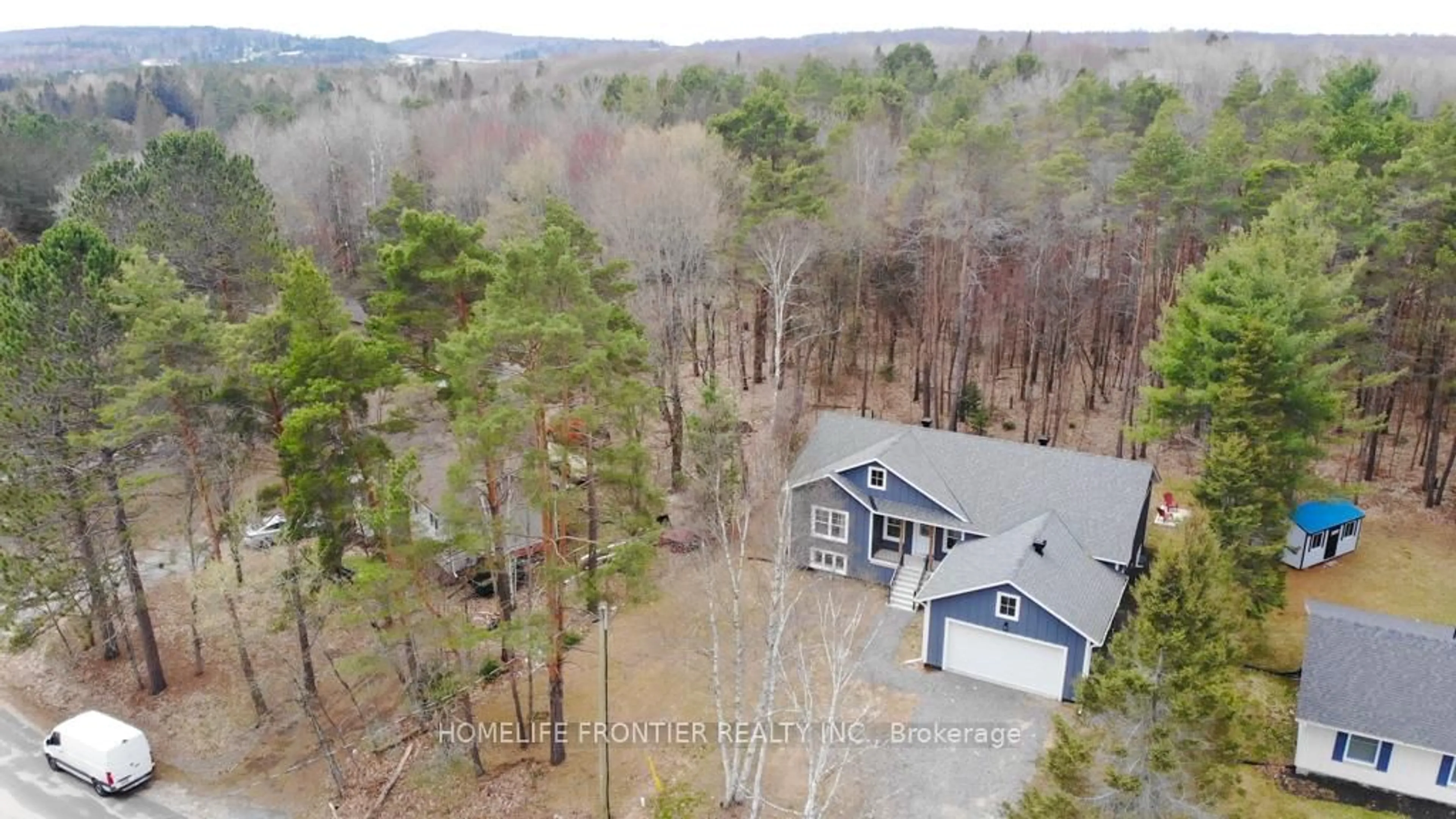 A pic from outside/outdoor area/front of a property/back of a property/a pic from drone, forest/trees view for 18 Murray St, Sundridge Ontario P0A 1Z0