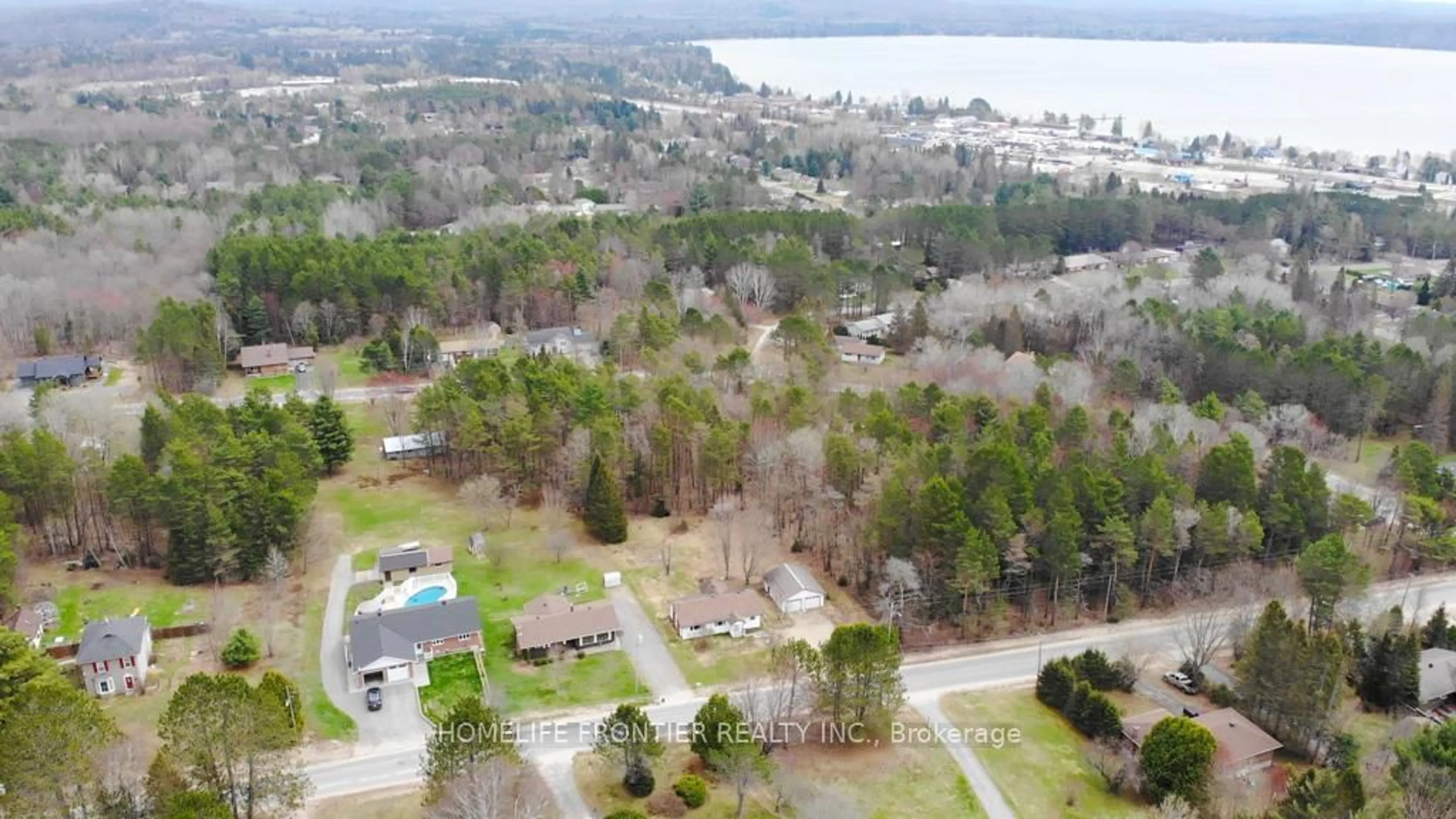 A pic from outside/outdoor area/front of a property/back of a property/a pic from drone, water/lake/river/ocean view for 18 Murray St, Sundridge Ontario P0A 1Z0