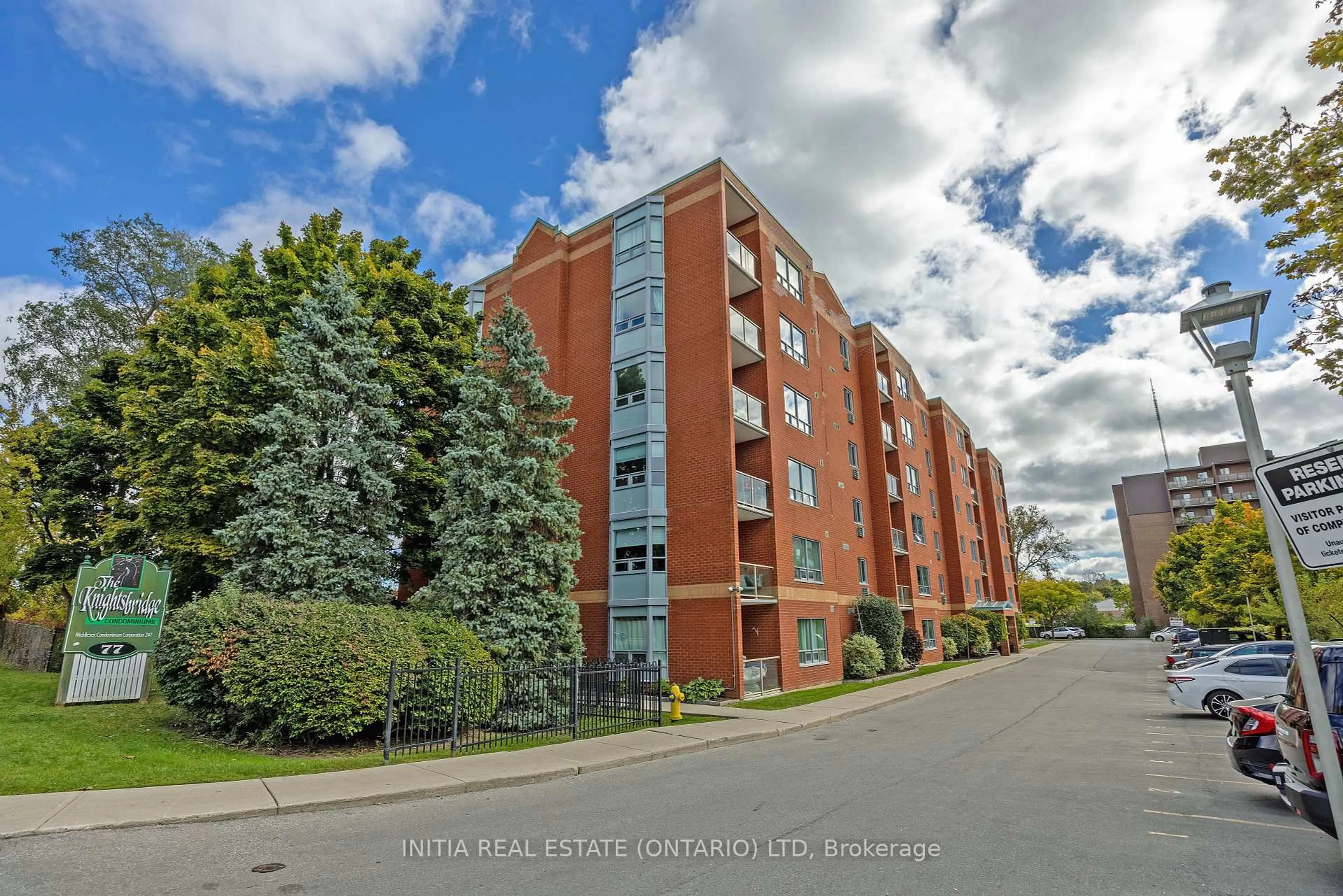 A pic from outside/outdoor area/front of a property/back of a property/a pic from drone, unknown for 77 Baseline Rd #104, London South Ontario N6J 1V5