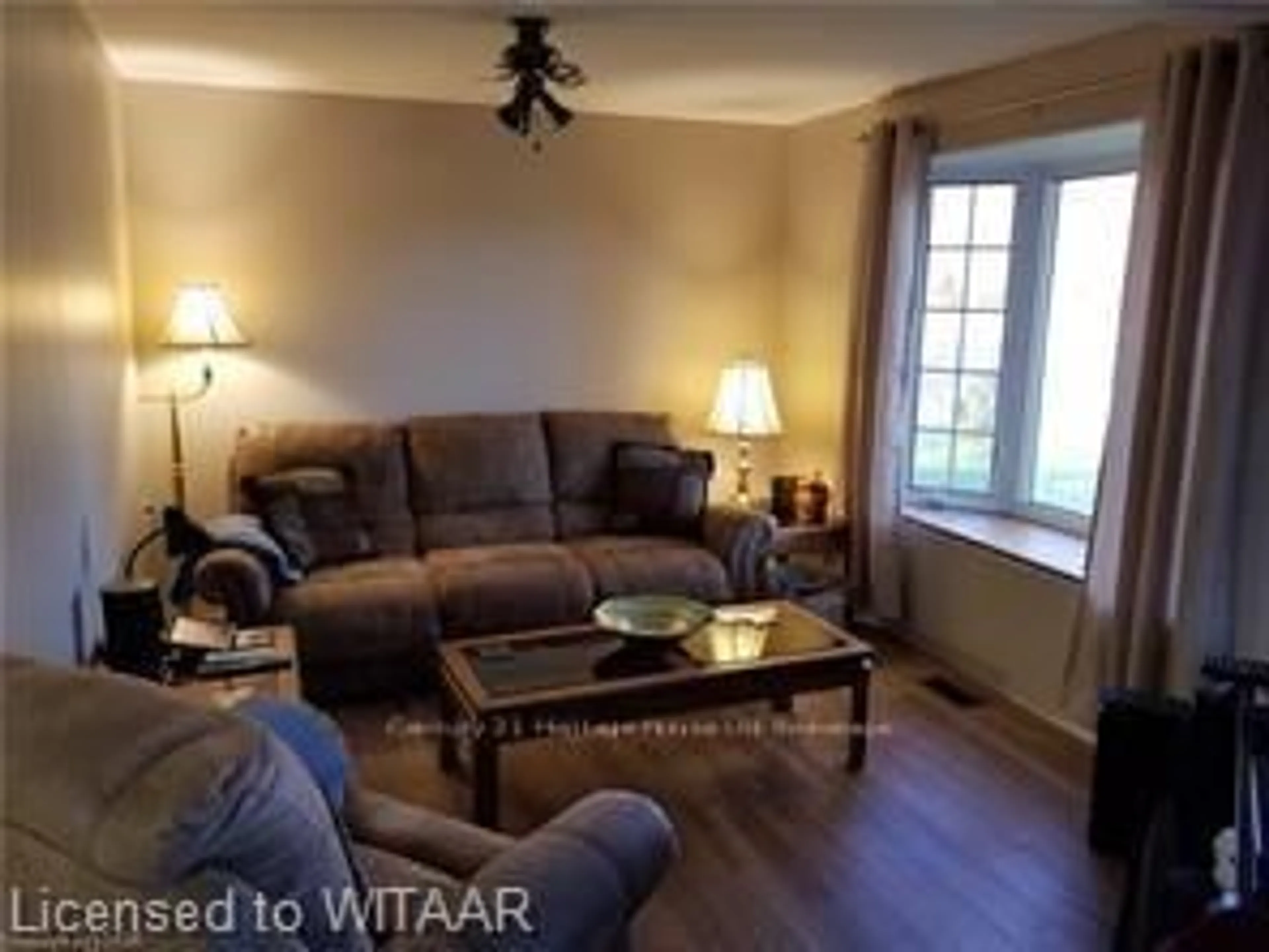 Living room with furniture, wood/laminate floor for 334319 ROSSLAND Line, South-West Oxford Ontario N5C 3J8