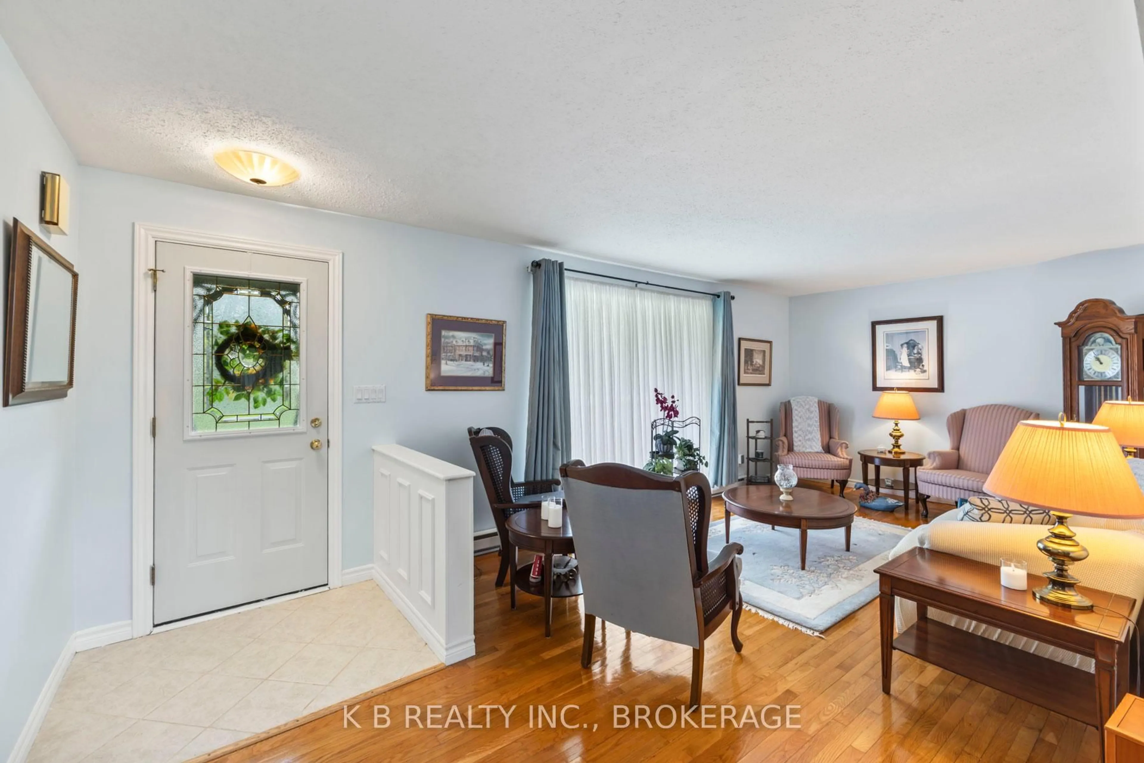 Living room with furniture, wood/laminate floor for 7350 County 2 Rd, Napanee Ontario K7R 3K6