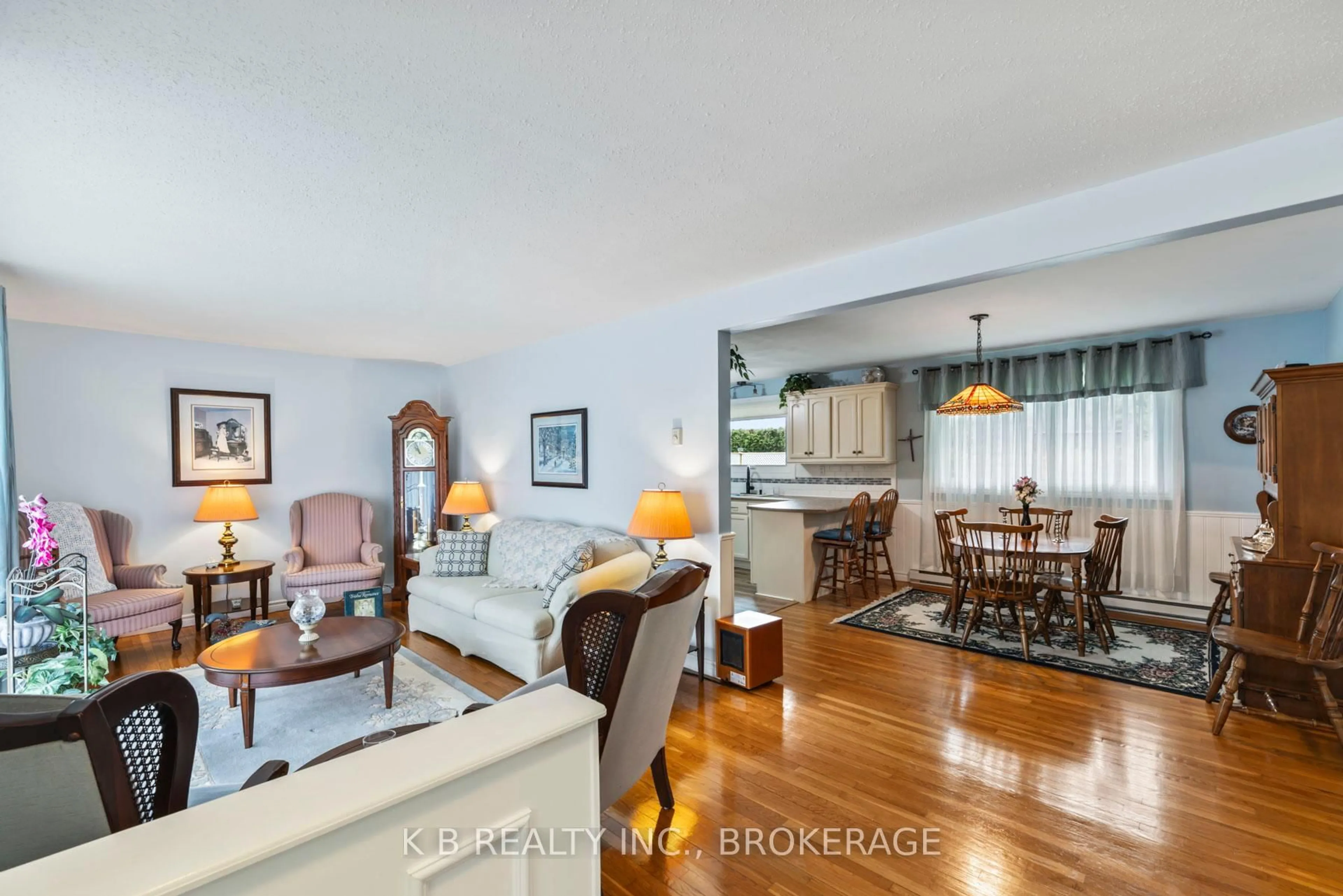 Living room with furniture, wood/laminate floor for 7350 County 2 Rd, Napanee Ontario K7R 3K6